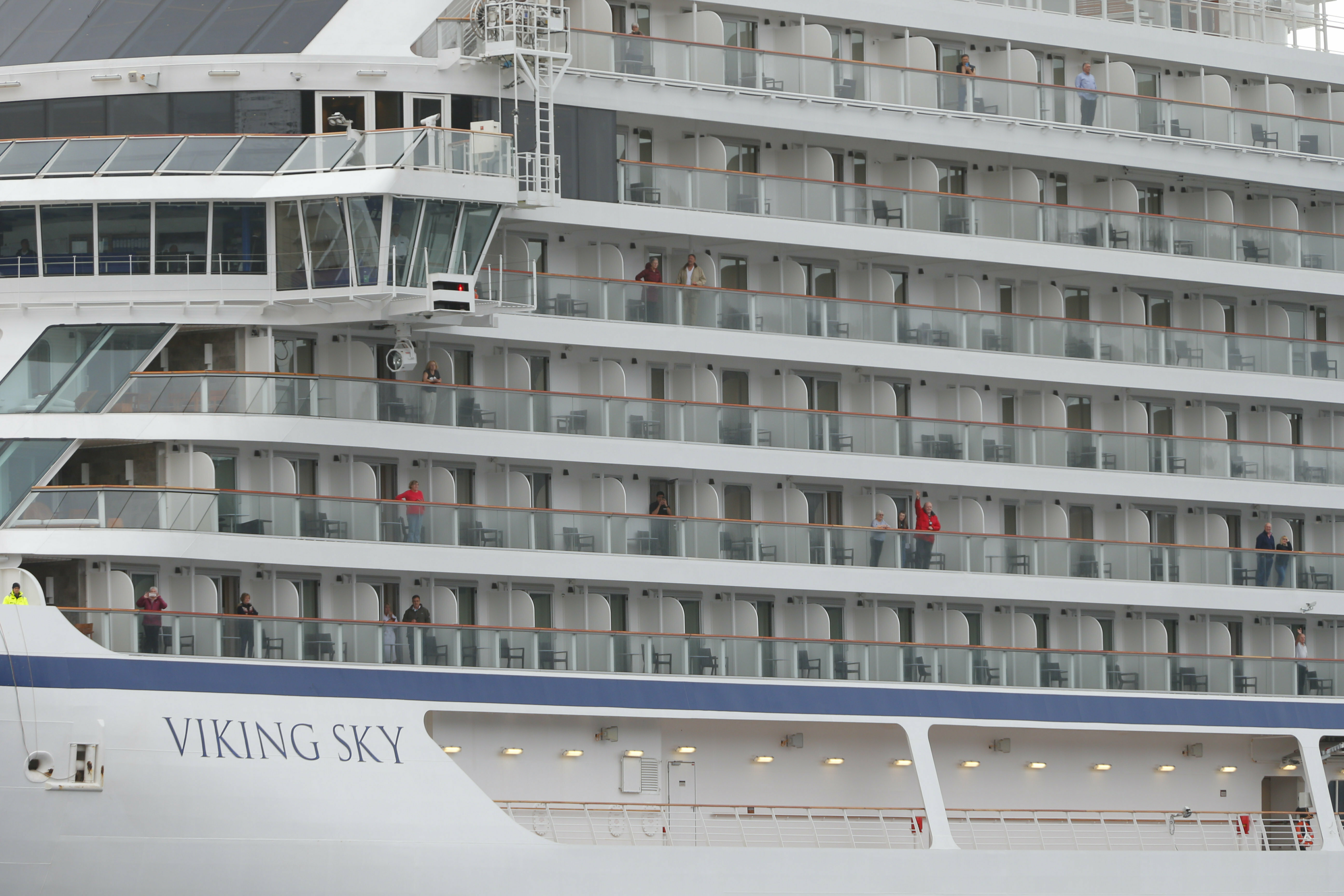 Some of the remaining passengers look out as the cruise ship Viking Sky arrives at port off Molde, Norway, Sunday March 24, 2019, after having problems and issuing a Mayday call on Saturday in heavy seas off Norway's western coast. Rescue helicopters took more than 475 passengers from a cruise ship that got stranded off Norway's western coast in bad weather before the vessel departed for a nearby port under escort and with nearly 900 people still on board, the ship's owner said Sunday. (Svein Ove Ekornesvag/NTB scanpix via AP) Some of the remaining passengers look out as the cruise ship Viking Sky arrives at port off Molde, Norway, Sunday March 24, 2019, after having problems and issuing a Mayday call on Saturday in heavy seas off Norway's western coast. Rescue helicopters took more than 475 passengers from a cruise ship that got stranded off Norway's western coast in bad weather before the vessel departed for a nearby port under escort and with nearly 900 people still on board, the ship's owner said Sunday. (Svein Ove Ekornesvag/NTB scanpix via AP)