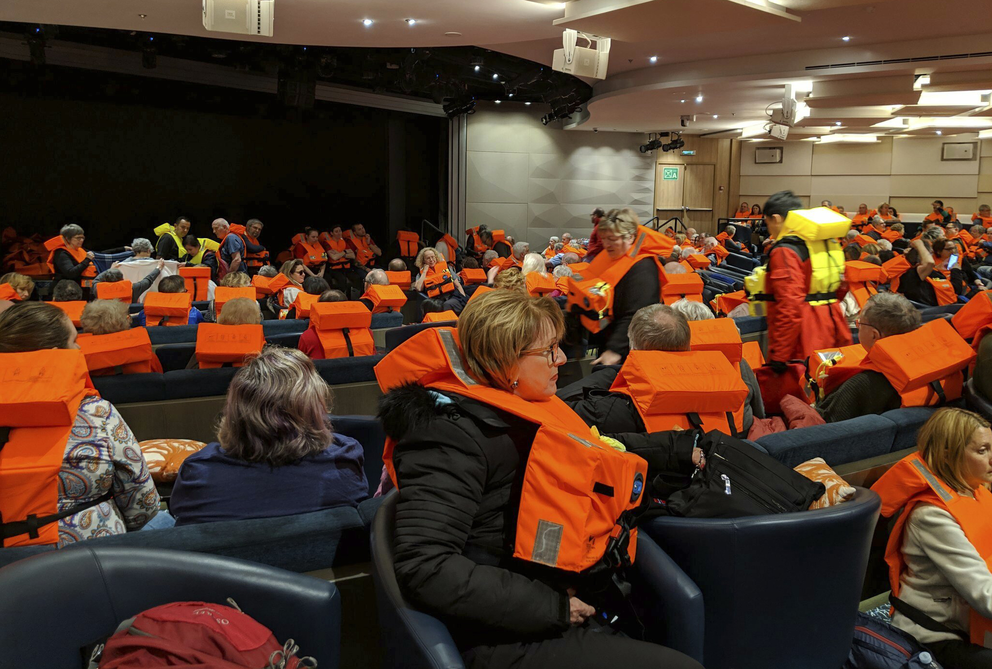 This photo provided by Michal Stewart shows passengers on board the Viking Sky, waiting to be evacuated, off the coast of Norway on Saturday, March 23, 2019. Rescue workers off Norway's western coast rushed to evacuate 1,300 passengers and crew from the disabled cruise ship by helicopter on Saturday, winching them one-by-one to safety as heaving waves tossed the ship from side to side and high winds battered the operation. (Michal Stewart via AP) This photo provided by Michal Stewart shows passengers on board the Viking Sky, waiting to be evacuated, off the coast of Norway on Saturday, March 23, 2019. Rescue workers off Norway's western coast rushed to evacuate 1,300 passengers and crew from the disabled cruise ship by helicopter on Saturday, winching them one-by-one to safety as heaving waves tossed the ship from side to side and high winds battered the operation. (Michal Stewart via AP)