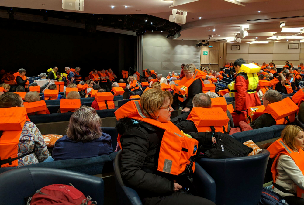 This photo provided by Michal Stewart shows passengers on board the Viking Sky, waiting to be evacuated, off the coast of Norway on Saturday, March 23, 2019. Rescue workers off Norway's western coast rushed to evacuate 1,300 passengers and crew from the disabled cruise ship by helicopter on Saturday, winching them one-by-one to safety as heaving waves tossed the ship from side to side and high winds battered the operation. (Michal Stewart via AP) This photo provided by Michal Stewart shows passengers on board the Viking Sky, waiting to be evacuated, off the coast of Norway on Saturday, March 23, 2019. Rescue workers off Norway's western coast rushed to evacuate 1,300 passengers and crew from the disabled cruise ship by helicopter on Saturday, winching them one-by-one to safety as heaving waves tossed the ship from side to side and high winds battered the operation. (Michal Stewart via AP)
