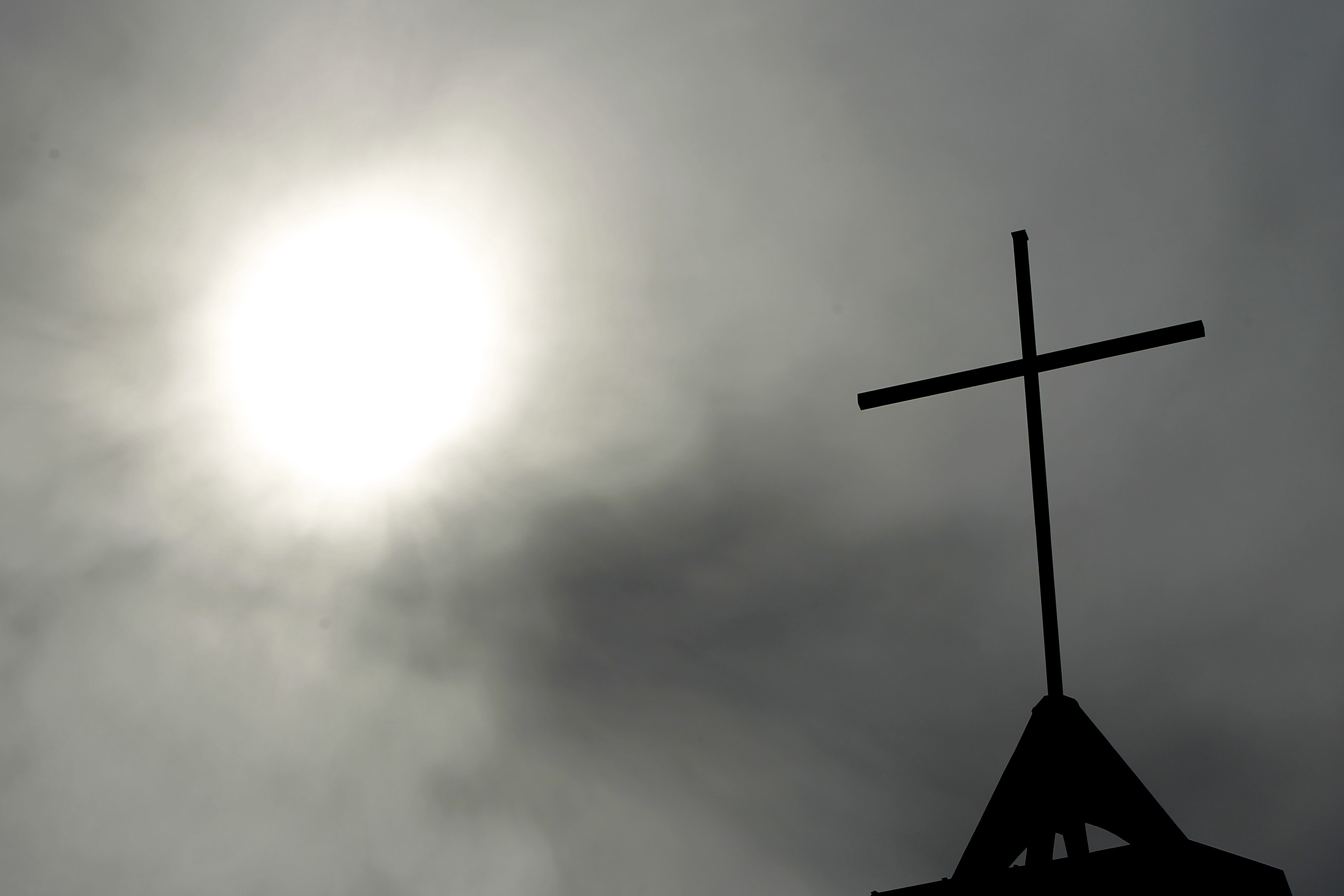 FILE - In this April 8, 2010 file photo a cross sits on top of a church in Berlin, Germany. In September 2018, the German Catholic Church released a devastating report that concluded at least 3,677 people were abused by clergy between 1946 and 2014. Pope Francis' high-stakes sex abuse prevention summit is meant to call attention to the crisis as a global problem that requires a global response. (AP Photo/Markus Schreiber, File) FILE - In this April 8, 2010 file photo a cross sits on top of a church in Berlin, Germany. In September 2018, the German Catholic Church released a devastating report that concluded at least 3,677 people were abused by clergy between 1946 and 2014. Pope Francis' high-stakes sex abuse prevention summit is meant to call attention to the crisis as a global problem that requires a global response. (AP Photo/Markus Schreiber, File)