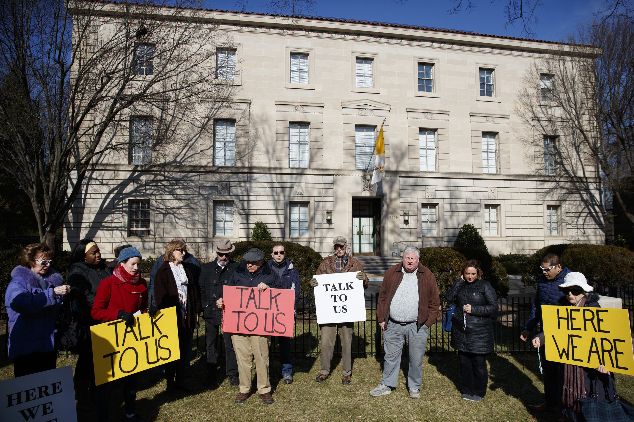 FILE - In this Feb. 16, 2019 file photo, a group with Catholic Laity for Orthodox Bishops and Reform gathers to pray the rosary outside the Apostolic Nunciature of the Holy See in Washington. Pope Francis' high-stakes sex abuse prevention summit is meant to call attention to the crisis as a global problem that requires a global response. After the abuse scandal erupted in Boston in 2002, U.S. bishops adopted the toughest anti-abuse norms in the Catholic Church, a FILE - In this Feb. 16, 2019 file photo, a group with Catholic Laity for Orthodox Bishops and Reform gathers to pray the rosary outside the Apostolic Nunciature of the Holy See in Washington. Pope Francis' high-stakes sex abuse prevention summit is meant to call attention to the crisis as a global problem that requires a global response. After the abuse scandal erupted in Boston in 2002, U.S. bishops adopted the toughest anti-abuse norms in the Catholic Church, a