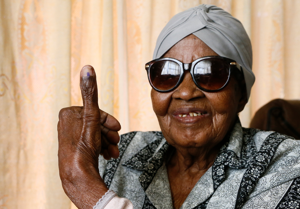 108-year-old MMaphuti Mabitsela shows her marked thumb nail after casting her special vote, at her home in Atteridgeville, near Pretoria, South Africa on Monday May 6, 2019. Mabitsela took part in South Africa's special voting for the elderly and infirm where electoral officials go to their homes or care facilities before the actual voting day of May 8. (AP Photo/Phill Magakoe) 108-year-old MMaphuti Mabitsela shows her marked thumb nail after casting her special vote, at her home in Atteridgeville, near Pretoria, South Africa on Monday May 6, 2019. Mabitsela took part in South Africa's special voting for the elderly and infirm where electoral officials go to their homes or care facilities before the actual voting day of May 8. (AP Photo/Phill Magakoe)