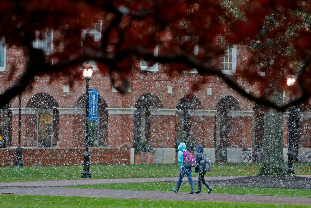 Christopher Newport University students make their way through campus as snow falls, Tuesday afternoon, Nov. 12, 2019 in Newport News, Va. (Jonathon Gruenke/The Virginian-Pilot via AP) Christopher Newport University students make their way through campus as snow falls, Tuesday afternoon, Nov. 12, 2019 in Newport News, Va. (Jonathon Gruenke/The Virginian-Pilot via AP)