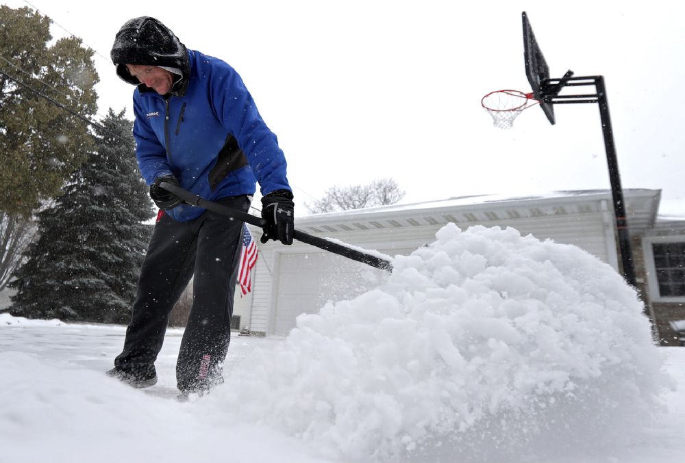 Kenny Stuyvenberg shovels his driveway as the latest round of winter weather moves through the Fox Cities on Wednesday, November 13, 2019, in Kimberly, Wis. (Wm. Glasheen/The Post-Crescent via AP) Kenny Stuyvenberg shovels his driveway as the latest round of winter weather moves through the Fox Cities on Wednesday, November 13, 2019, in Kimberly, Wis. (Wm. Glasheen/The Post-Crescent via AP)
