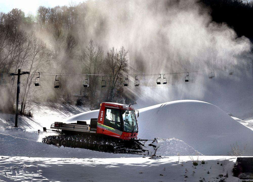 Snow billows from a snowmaker, Tuesday, Nov. 12, 2019, creating piles as Tom Roesler, mountain manager at Mount La Crosse in La Crosse, Wis., spreads it out. Pending weather conditions, Mount La Crosse staff are hoping to open the ski area before the end of the month. (Peter Thomson/La Crosse Tribune via AP) Snow billows from a snowmaker, Tuesday, Nov. 12, 2019, creating piles as Tom Roesler, mountain manager at Mount La Crosse in La Crosse, Wis., spreads it out. Pending weather conditions, Mount La Crosse staff are hoping to open the ski area before the end of the month. (Peter Thomson/La Crosse Tribune via AP)