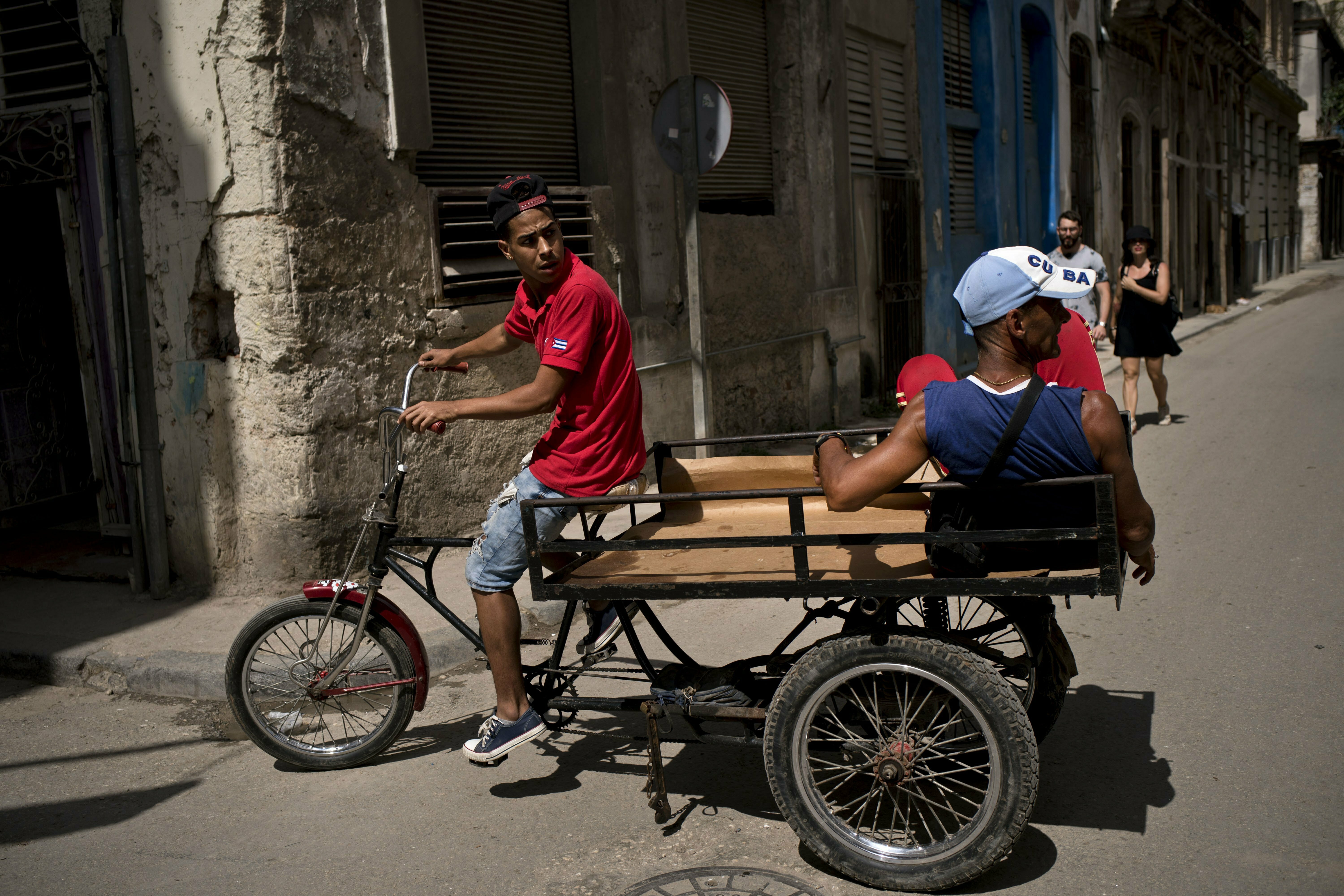 A man pedaling a tricycle equipped with a platform earns a living by transporting passengers through Havana, Cuba, Wednesday, April 10, 2019. Communist Party leader Raúl Castro warned Cubans on Wednesday that they should brace for worsening shortages due to Trump administration policies, but said the island won't return to the extreme deprivation of the post-Soviet period. (AP Photo/Ramon Espinosa) A man pedaling a tricycle equipped with a platform earns a living by transporting passengers through Havana, Cuba, Wednesday, April 10, 2019. Communist Party leader Raúl Castro warned Cubans on Wednesday that they should brace for worsening shortages due to Trump administration policies, but said the island won't return to the extreme deprivation of the post-Soviet period. (AP Photo/Ramon Espinosa)