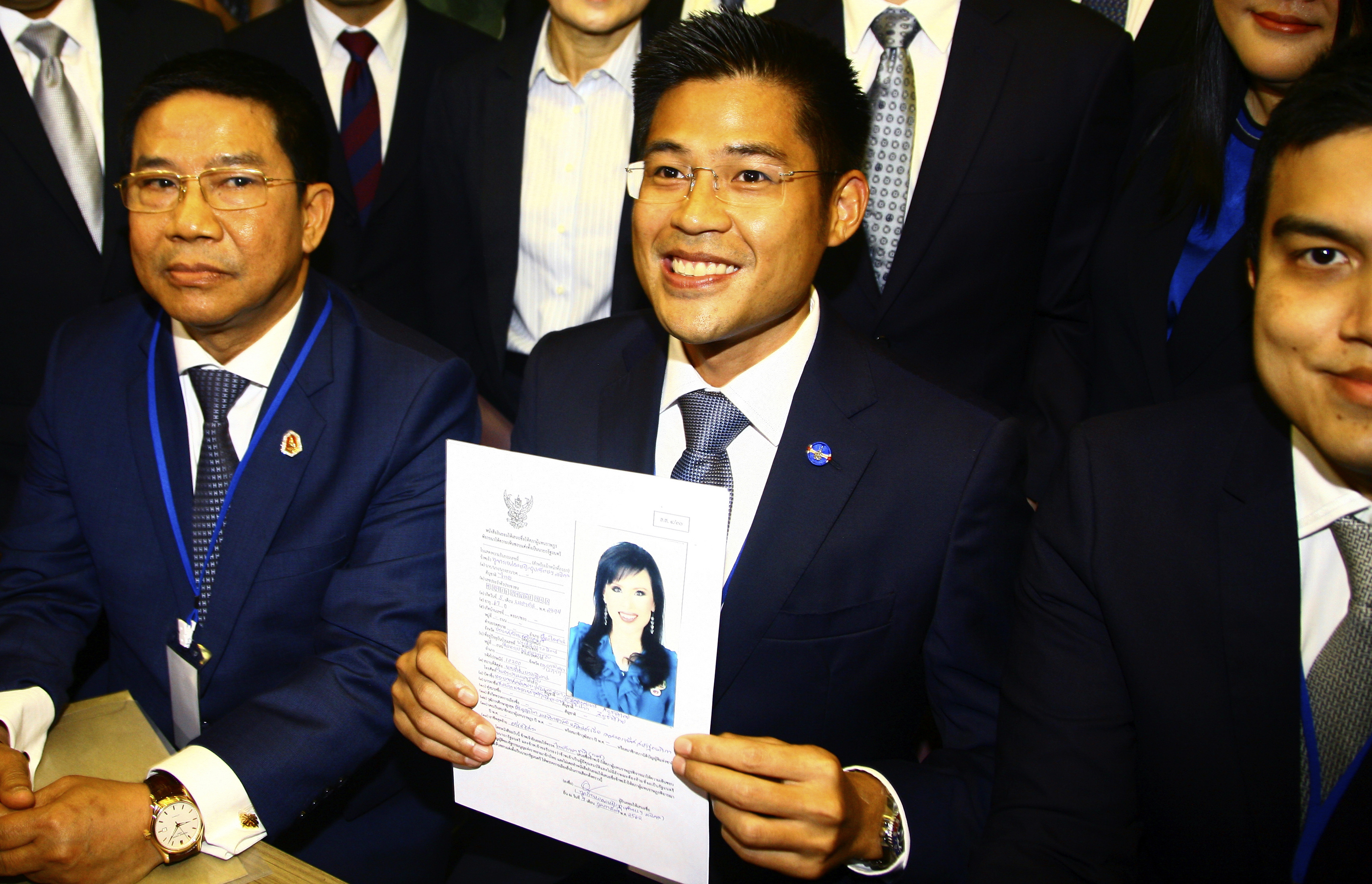 Leader of Thai Raksa Chart party Preecha Pholphongpanich, center, holds a picture of Princess Ubolratana at election commission of Thailand in Bangkok, Thailand, Friday, Feb. 8, 2019. The political party has selected the princess as its nominee to serve as the next prime minister, upending tradition that the royal palace plays no public role in politics and upsetting all predictions about what may happen in the March election. (AP Photo) Leader of Thai Raksa Chart party Preecha Pholphongpanich, center, holds a picture of Princess Ubolratana at election commission of Thailand in Bangkok, Thailand, Friday, Feb. 8, 2019. The political party has selected the princess as its nominee to serve as the next prime minister, upending tradition that the royal palace plays no public role in politics and upsetting all predictions about what may happen in the March election. (AP Photo)