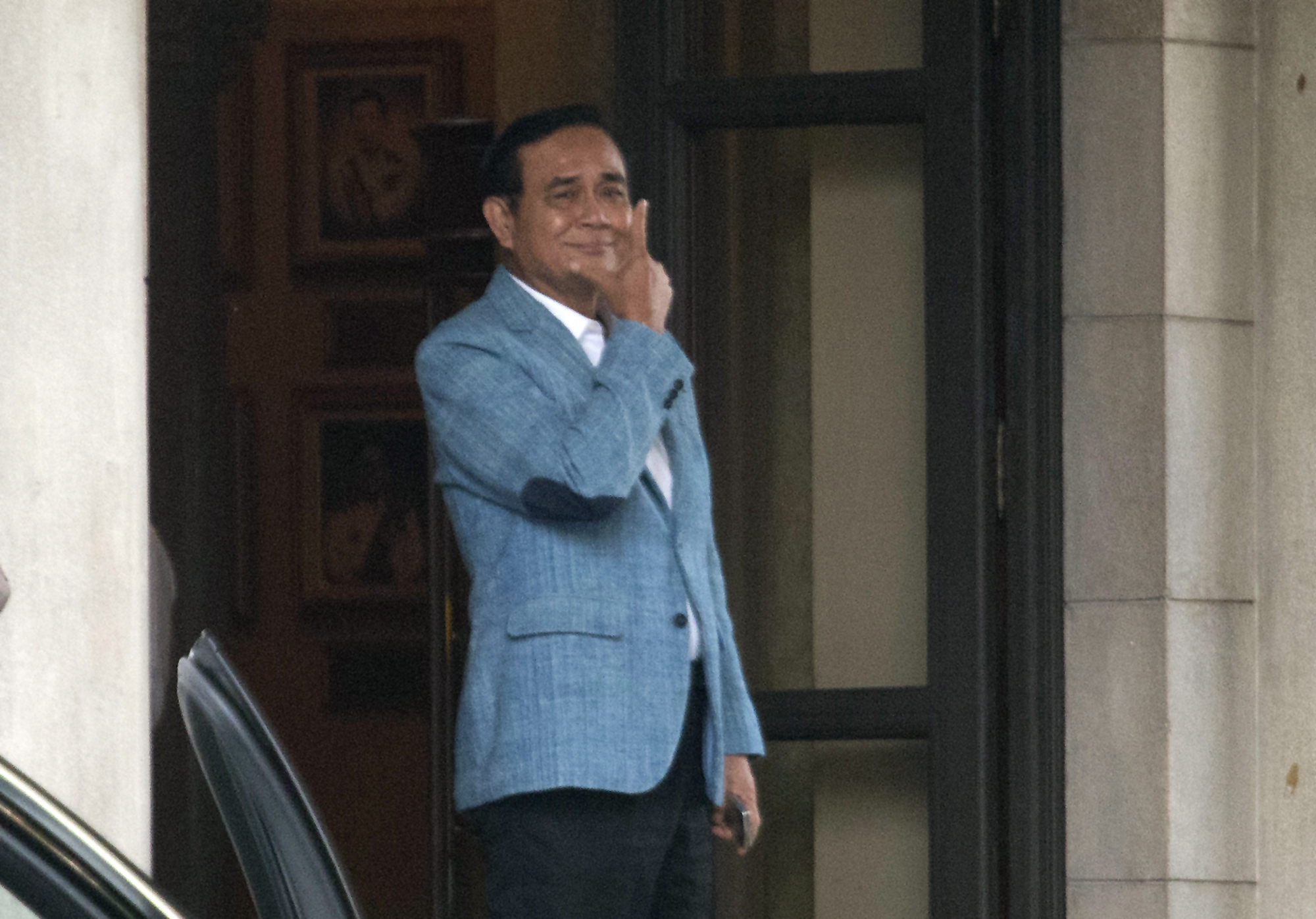 Thai Prime Minister Prayuth Chan-ocha leaves the government house in Bangkok, Thailand, Friday, Feb. 8, 2019. Prayuth, who led the 2014 coup that ousted Thailand's last elected government, on Friday accepted his selection as candidate to lead the next government by Palang Pracharat Party, widely seen as a proxy for the military. (AP Photo/Sakchai Lalit) Thai Prime Minister Prayuth Chan-ocha leaves the government house in Bangkok, Thailand, Friday, Feb. 8, 2019. Prayuth, who led the 2014 coup that ousted Thailand's last elected government, on Friday accepted his selection as candidate to lead the next government by Palang Pracharat Party, widely seen as a proxy for the military. (AP Photo/Sakchai Lalit)