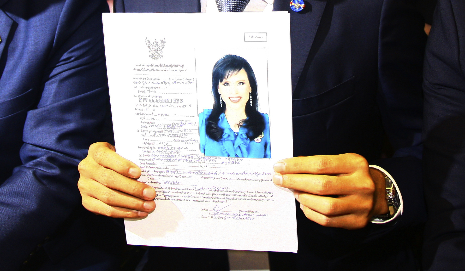Leader of Thai Raksa Chart party Preecha Pholphongpanich holds a picture of Princess Ubolratana at election commission of Thailand in Bangkok, Thailand, Friday, Feb. 8, 2019. The political party has selected a princess as its nominee to serve as the next prime minister, upending tradition that the royal palace plays no public role in politics and upsetting all predictions about what may happen in the March election. (AP Photo) Leader of Thai Raksa Chart party Preecha Pholphongpanich holds a picture of Princess Ubolratana at election commission of Thailand in Bangkok, Thailand, Friday, Feb. 8, 2019. The political party has selected a princess as its nominee to serve as the next prime minister, upending tradition that the royal palace plays no public role in politics and upsetting all predictions about what may happen in the March election. (AP Photo)