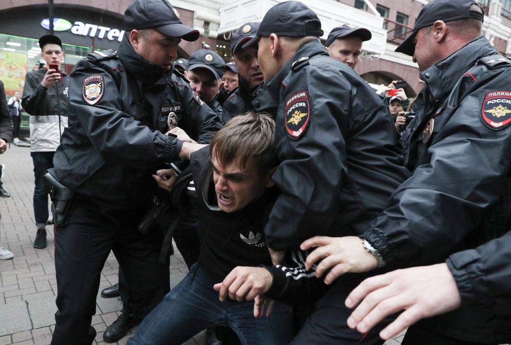 Police detain an activist during a protest in the center of Moscow, Russia, Saturday, Aug. 17, 2019. People rallied Saturday against the exclusion of some city council candidates from Moscow's upcoming election. (AP Photo) Police detain an activist during a protest in the center of Moscow, Russia, Saturday, Aug. 17, 2019. People rallied Saturday against the exclusion of some city council candidates from Moscow's upcoming election. (AP Photo)