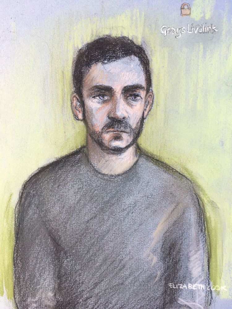 Court artist sketch by Elizabeth Cook shows lorry driver Maurice Robinson, 25, on a video-link at Chelmsford Magistrates' Court, England, Monday Oct. 28, 2019. Authorities found 39 people dead in a truck in an industrial park in England on Wednesday and arrested the driver on suspicion of murder in one of Britain's worst human-smuggling tragedies. (Elizabeth Cook/PA via AP) Court artist sketch by Elizabeth Cook shows lorry driver Maurice Robinson, 25, on a video-link at Chelmsford Magistrates' Court, England, Monday Oct. 28, 2019. Authorities found 39 people dead in a truck in an industrial park in England on Wednesday and arrested the driver on suspicion of murder in one of Britain's worst human-smuggling tragedies. (Elizabeth Cook/PA via AP)