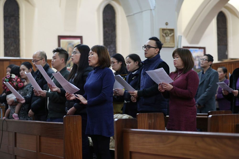 Worshippers pray during a Mass and vigil for the 39 victims found dead inside the back of a truck in Grays, Essex, at The Holy Name and Our Lady of the Sacred Heart Church, east London's Vietnamese church on Saturday, Nov. 2, 2019. All those killed were Vietnamese nationals, British police said. (Yui Mok/PA via AP) Worshippers pray during a Mass and vigil for the 39 victims found dead inside the back of a truck in Grays, Essex, at The Holy Name and Our Lady of the Sacred Heart Church, east London's Vietnamese church on Saturday, Nov. 2, 2019. All those killed were Vietnamese nationals, British police said. (Yui Mok/PA via AP)