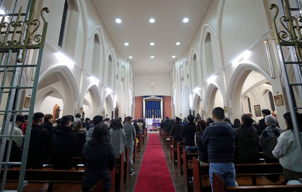 The priest of the Vietnamese Catholic Cathedral in east London, Father Simon Thang Duc Nguyen, speaks at The Holy Name and Our Lady of the Sacred Heart Church, London's Vietnamese church, in east London. Saturday Nov. 2, 2019, during a service and vigil to honor the 39 victims who died in a refrigerated truck container found on Oct. 23. The community is mourning the unidentified victims, who were trying to enter Britain in hopes of finding opportunity. (Yui Mok/PA via AP) The priest of the Vietnamese Catholic Cathedral in east London, Father Simon Thang Duc Nguyen, speaks at The Holy Name and Our Lady of the Sacred Heart Church, London's Vietnamese church, in east London. Saturday Nov. 2, 2019, during a service and vigil to honor the 39 victims who died in a refrigerated truck container found on Oct. 23. The community is mourning the unidentified victims, who were trying to enter Britain in hopes of finding opportunity. (Yui Mok/PA via AP)