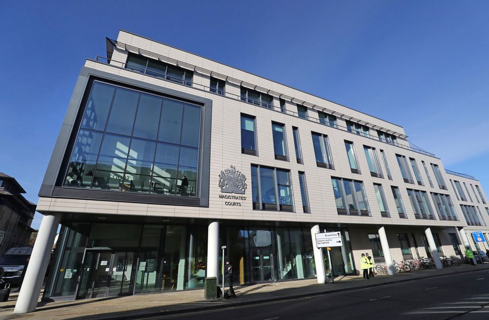 Police stand outside Chelmsford Magistrates' Court, England, where lorry driver Maurice Robinson, 25, will appear on Monday Oct. 28, 2019. Authorities found 39 people dead in a truck in an industrial park in England on Wednesday and arrested the driver on suspicion of murder in one of Britain's worst human-smuggling tragedies. (Gareth Fuller/PA via AP) Police stand outside Chelmsford Magistrates' Court, England, where lorry driver Maurice Robinson, 25, will appear on Monday Oct. 28, 2019. Authorities found 39 people dead in a truck in an industrial park in England on Wednesday and arrested the driver on suspicion of murder in one of Britain's worst human-smuggling tragedies. (Gareth Fuller/PA via AP)