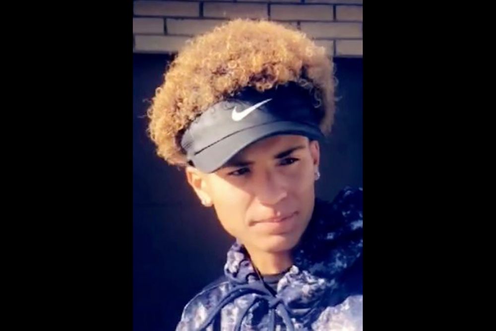 This undated photo provided by Serina Rides shows her son Elijah Al-Amin. Hundreds of people including Democratic presidential candidate Cory Booker spoke out on Twitter this week after Al-Amin, a 17-year-old black youth, was killed at suburban convenience store, allegedly by Michael Adams, a white man who has said he felt threatened by the boy's rap music, on July 4, 2019, in Peoria, Ariz. Adams was charged Tuesday, July 9, 2019, with first-degree murder. (Serina Rides via AP) This undated photo provided by Serina Rides shows her son Elijah Al-Amin. Hundreds of people including Democratic presidential candidate Cory Booker spoke out on Twitter this week after Al-Amin, a 17-year-old black youth, was killed at suburban convenience store, allegedly by Michael Adams, a white man who has said he felt threatened by the boy's rap music, on July 4, 2019, in Peoria, Ariz. Adams was charged Tuesday, July 9, 2019, with first-degree murder. (Serina Rides via AP)