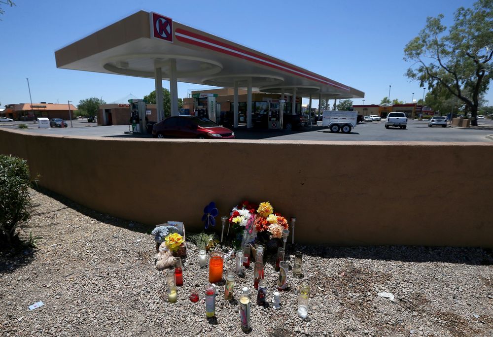 A makeshift memorial is set up for Elijah Al-Amin at a local Circle K store for the death of the stabbing victim Tuesday, July 9, 2019, in Peoria, Ariz. Peoria police arrested 27-year-old Michael Adams on suspicion of first-degree murder in the killing of 17-year-old Al-Amin, who was stabbed in his throat and back inside the store on July 4. Hundreds of people including a presidential candidate are speaking out on Twitter about the killing of a 17-year-old Muslim youth at a suburban convenience store by a white man who said he was threatened by the boy's rap music. (AP Photo/Ross D. Franklin) A makeshift memorial is set up for Elijah Al-Amin at a local Circle K store for the death of the stabbing victim Tuesday, July 9, 2019, in Peoria, Ariz. Peoria police arrested 27-year-old Michael Adams on suspicion of first-degree murder in the killing of 17-year-old Al-Amin, who was stabbed in his throat and back inside the store on July 4. Hundreds of people including a presidential candidate are speaking out on Twitter about the killing of a 17-year-old Muslim youth at a suburban convenience store by a white man who said he was threatened by the boy's rap music. (AP Photo/Ross D. Franklin)