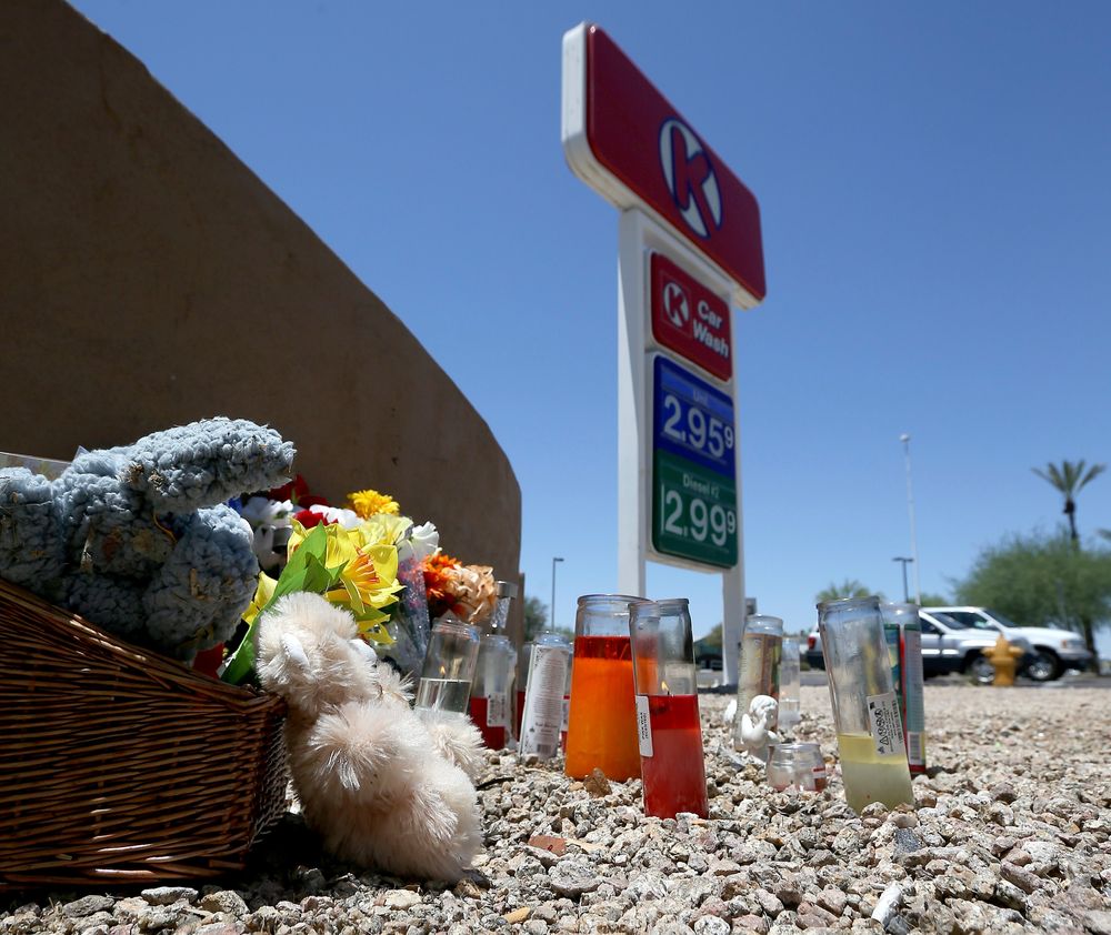 A makeshift memorial for Elijah Al-Amin is set up at a local Circle K store for the death of the stabbing victim Tuesday, July 9, 2019, in Peoria, Ariz. Peoria police arrested 27-year-old Michael Adams on suspicion of first-degree murder in the killing of 17-year-old Al-Amin, who was stabbed in his throat and back inside the store on July 4. Hundreds of people including a presidential candidate are speaking out on Twitter about the killing of a 17-year-old Muslim youth at a suburban convenience store by a white man who said he was threatened by the boy's rap music. (AP Photo/Ross D. Franklin) A makeshift memorial for Elijah Al-Amin is set up at a local Circle K store for the death of the stabbing victim Tuesday, July 9, 2019, in Peoria, Ariz. Peoria police arrested 27-year-old Michael Adams on suspicion of first-degree murder in the killing of 17-year-old Al-Amin, who was stabbed in his throat and back inside the store on July 4. Hundreds of people including a presidential candidate are speaking out on Twitter about the killing of a 17-year-old Muslim youth at a suburban convenience store by a white man who said he was threatened by the boy's rap music. (AP Photo/Ross D. Franklin)