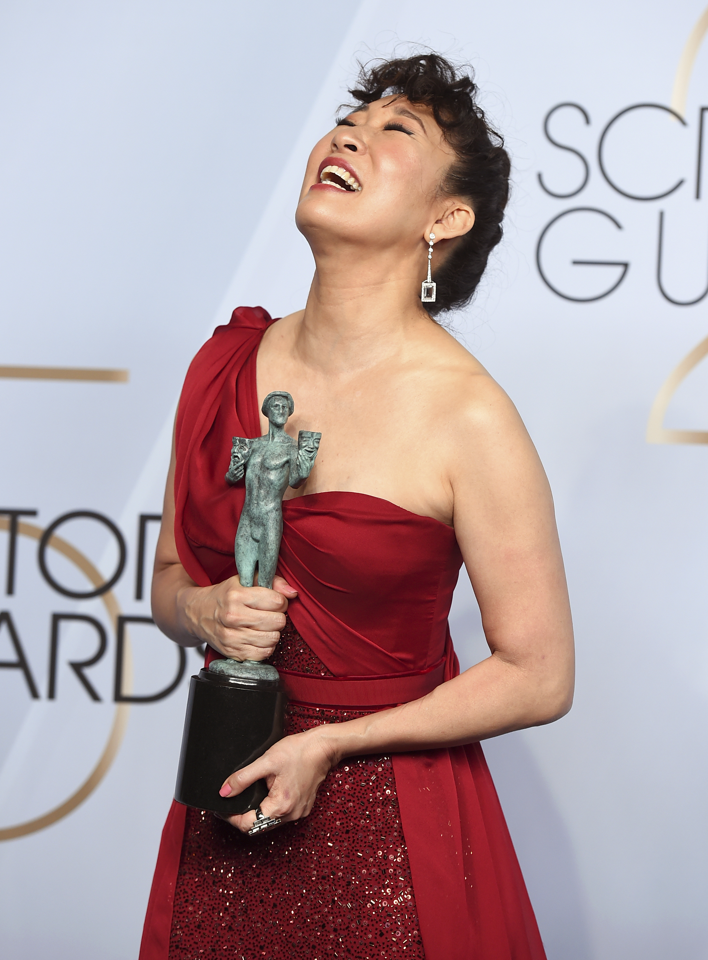Sandra Oh poses with the award for outstanding performance by a female actor in a drama series for Sandra Oh poses with the award for outstanding performance by a female actor in a drama series for