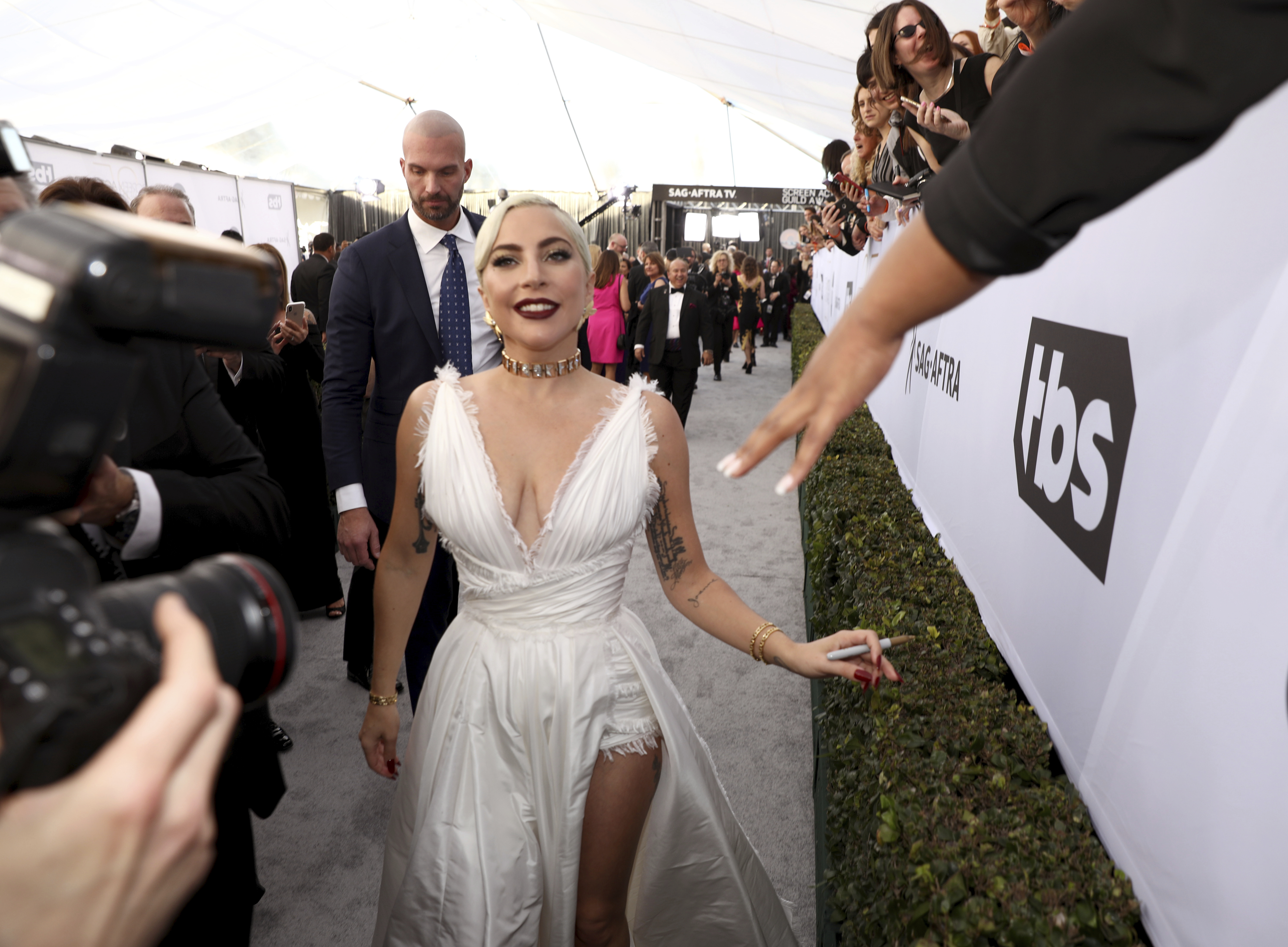 Lady Gaga interacts with fans at the 25th annual Screen Actors Guild Awards at the Shrine Auditorium & Expo Hall on Sunday, Jan. 27, 2019, in Los Angeles. (Photo by Matt Sayles/Invision/AP) Lady Gaga interacts with fans at the 25th annual Screen Actors Guild Awards at the Shrine Auditorium & Expo Hall on Sunday, Jan. 27, 2019, in Los Angeles. (Photo by Matt Sayles/Invision/AP)