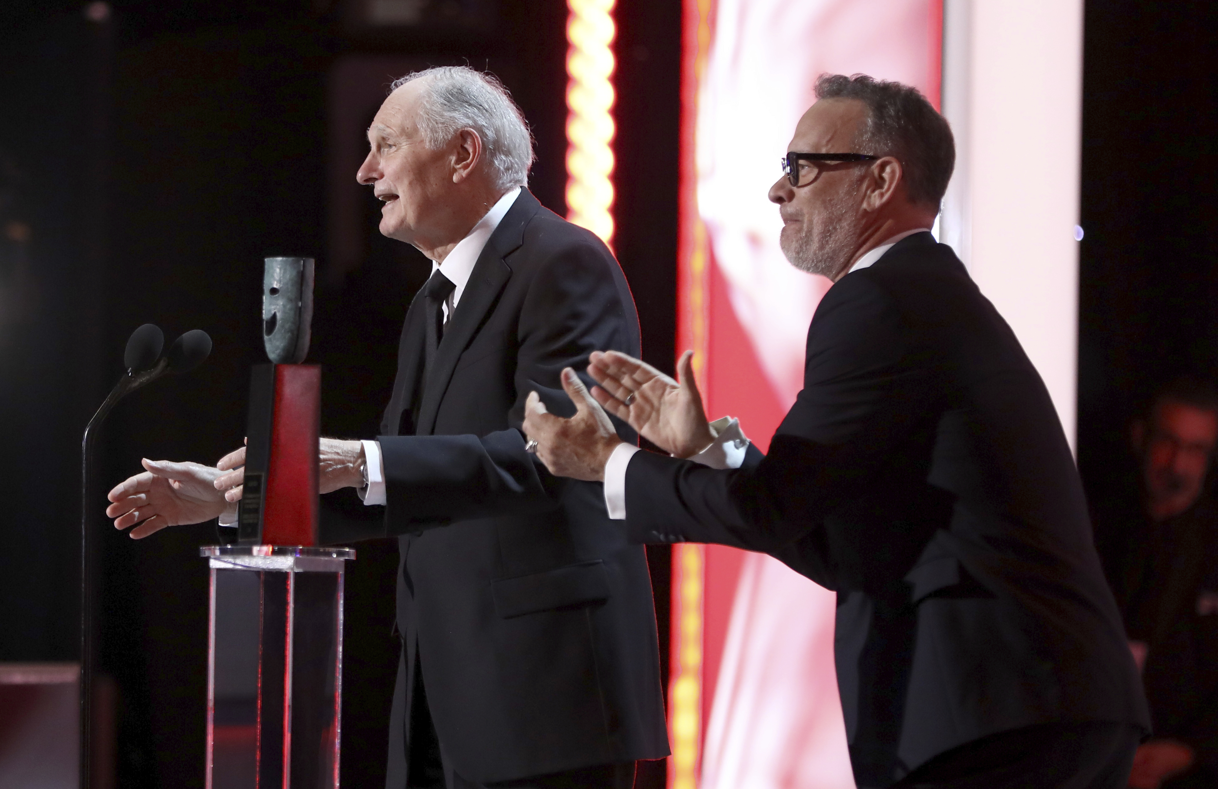 Alan Alda, left, accepts the Life Achievement award while Tom Hanks applauds at the 25th annual Screen Actors Guild Awards at the Shrine Auditorium & Expo Hall on Sunday, Jan. 27, 2019, in Los Angeles. (Photo by Matt Sayles/Invision/AP) Alan Alda, left, accepts the Life Achievement award while Tom Hanks applauds at the 25th annual Screen Actors Guild Awards at the Shrine Auditorium & Expo Hall on Sunday, Jan. 27, 2019, in Los Angeles. (Photo by Matt Sayles/Invision/AP)