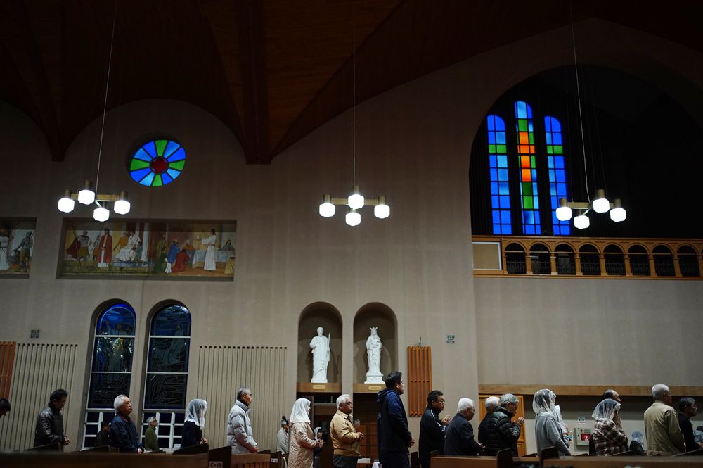 In this Nov. 17, 2019, photo, Catholics attend an early morning Mass at the Urakami Cathedral in Nagasaki, southern Japan. Pope Francis will start his first official visit to Japan in Nagasaki, ground zero for the Christian experience in a nation where the Catholic leader once dreamed of living as a missionary. (AP Photo/Eugene Hoshiko) In this Nov. 17, 2019, photo, Catholics attend an early morning Mass at the Urakami Cathedral in Nagasaki, southern Japan. Pope Francis will start his first official visit to Japan in Nagasaki, ground zero for the Christian experience in a nation where the Catholic leader once dreamed of living as a missionary. (AP Photo/Eugene Hoshiko)