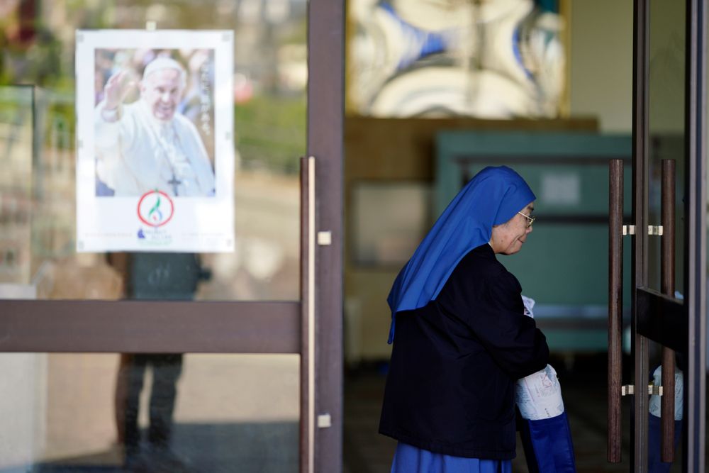 In this Nov. 17, 2019, photo, a Catholic nun walks by a poster of Pope Francis at the Urakami Cathedral in Nagasaki, southern Japan. Pope Francis will start his first official visit to Japan in Nagasaki, ground zero for the Christian experience in a nation where the Catholic leader once dreamed of living as a missionary. (AP Photo/Eugene Hoshiko) In this Nov. 17, 2019, photo, a Catholic nun walks by a poster of Pope Francis at the Urakami Cathedral in Nagasaki, southern Japan. Pope Francis will start his first official visit to Japan in Nagasaki, ground zero for the Christian experience in a nation where the Catholic leader once dreamed of living as a missionary. (AP Photo/Eugene Hoshiko)