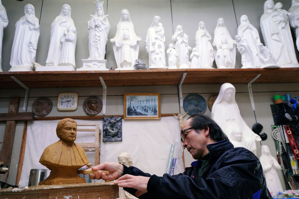 In this Nov. 16, 2019, photo, Mitsuho Nakata, a Catholic statue artist, works at his workshop near the Urakami Cathedral in Nagasaki, southern Japan. Pope Francis will start his first official visit to Japan in Nagasaki, ground zero for the Christian experience in a nation where the Catholic leader once dreamed of living as a missionary. (AP Photo/Eugene Hoshiko) In this Nov. 16, 2019, photo, Mitsuho Nakata, a Catholic statue artist, works at his workshop near the Urakami Cathedral in Nagasaki, southern Japan. Pope Francis will start his first official visit to Japan in Nagasaki, ground zero for the Christian experience in a nation where the Catholic leader once dreamed of living as a missionary. (AP Photo/Eugene Hoshiko)