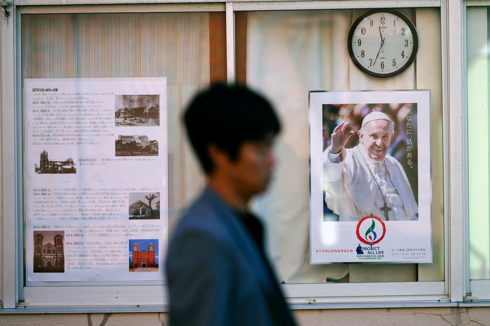 In this Nov. 16, 2019, photo, a man walks by a poster of Pope Francis at the Urakami Cathedral in Nagasaki, southern Japan. Pope Francis will start his first official visit to Japan in Nagasaki, ground zero for the Christian experience in a nation where the Catholic leader once dreamed of living as a missionary. (AP Photo/Eugene Hoshiko) In this Nov. 16, 2019, photo, a man walks by a poster of Pope Francis at the Urakami Cathedral in Nagasaki, southern Japan. Pope Francis will start his first official visit to Japan in Nagasaki, ground zero for the Christian experience in a nation where the Catholic leader once dreamed of living as a missionary. (AP Photo/Eugene Hoshiko)