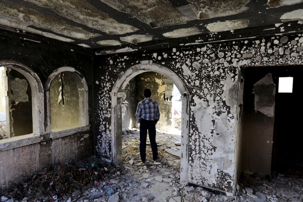 A former policeman walks through an abandoned home, torched by the Zetas cartel eight years back, in Allende, Coahuila state, Mexico, Tuesday, Dec. 3, 2019. In an act of revenge cartel members in 2011 razed and burned houses and disappeared people just by bearing the last name of the alleged traitor. Residents of the small town of Villa Union, 12 miles from Allende, said Tuesday that they fear a return to the days of 2010-2013, when the old Zetas cartel killed, burned and abducted Coahuila citizens. (AP Photo/Eduardo Verdugo) A former policeman walks through an abandoned home, torched by the Zetas cartel eight years back, in Allende, Coahuila state, Mexico, Tuesday, Dec. 3, 2019. In an act of revenge cartel members in 2011 razed and burned houses and disappeared people just by bearing the last name of the alleged traitor. Residents of the small town of Villa Union, 12 miles from Allende, said Tuesday that they fear a return to the days of 2010-2013, when the old Zetas cartel killed, burned and abducted Coahuila citizens. (AP Photo/Eduardo Verdugo)