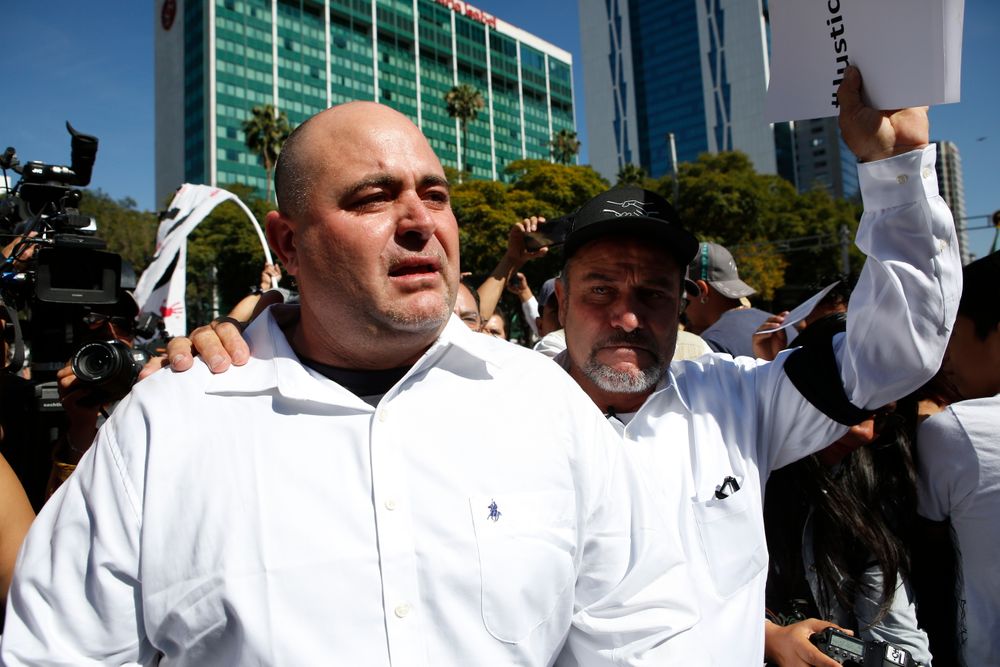 Julian LeBaron, left, walks with Adrian LeBaron before a protest against the first year in office of Mexico's President Andres Manuel Lopez Obrador, in Mexico City, Sunday, Dec. 1, 2019. The men joined a protest on Mexico City's Reforma avenue to expressed anger and frustration over increasingly appalling incidents of violence, a stagnant economy and deepening political divisions in the country. (AP Photo/Ginnette Riquelme) Julian LeBaron, left, walks with Adrian LeBaron before a protest against the first year in office of Mexico's President Andres Manuel Lopez Obrador, in Mexico City, Sunday, Dec. 1, 2019. The men joined a protest on Mexico City's Reforma avenue to expressed anger and frustration over increasingly appalling incidents of violence, a stagnant economy and deepening political divisions in the country. (AP Photo/Ginnette Riquelme)