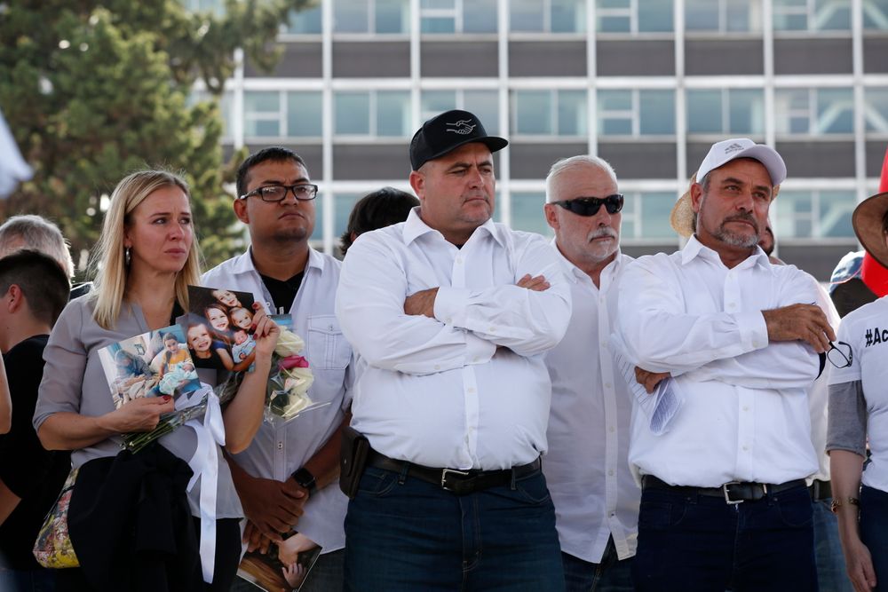 Adriana LeBaron, left, Julian LeBaron, center, and Adrian LeBaron, right, stand during a protest against the first year in office of Mexico's President Andres Manuel Lopez Obrador, in Mexico City, Monday, Dec. 1, 2019. The LeBaron's joined a protest on Reforma avenue to expressed anger and frustration over increasingly appalling incidents of violence, a stagnant economy and deepening political divisions in the country. (AP Photo/Ginnette Riquelme) Adriana LeBaron, left, Julian LeBaron, center, and Adrian LeBaron, right, stand during a protest against the first year in office of Mexico's President Andres Manuel Lopez Obrador, in Mexico City, Monday, Dec. 1, 2019. The LeBaron's joined a protest on Reforma avenue to expressed anger and frustration over increasingly appalling incidents of violence, a stagnant economy and deepening political divisions in the country. (AP Photo/Ginnette Riquelme)