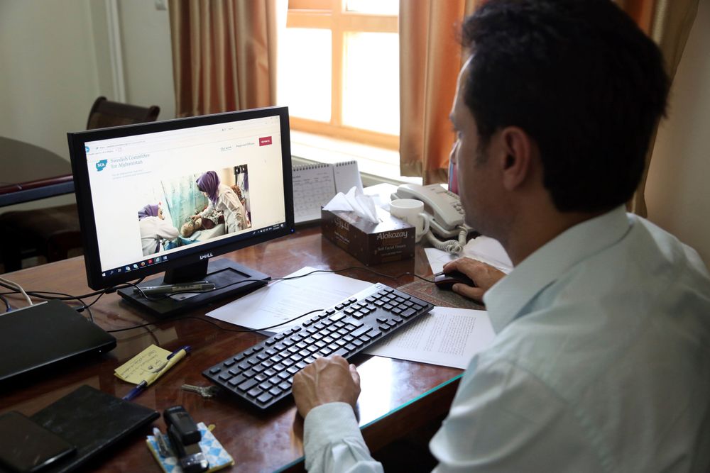Ahmad Khalid Fahim, program director for the Swedish Committee for Afghanistan shows the group's website during an interview with The Associated Press in Kabul, Afghanistan, Wednesday, July 17, 2019. The Swedish non-governmental organization in Afghanistan said the Taliban have forced the closure of 42 health facilities run by the non-profit group in eastern Maidan Wardan province. (AP Photo/Rahmat Gul) Ahmad Khalid Fahim, program director for the Swedish Committee for Afghanistan shows the group's website during an interview with The Associated Press in Kabul, Afghanistan, Wednesday, July 17, 2019. The Swedish non-governmental organization in Afghanistan said the Taliban have forced the closure of 42 health facilities run by the non-profit group in eastern Maidan Wardan province. (AP Photo/Rahmat Gul)