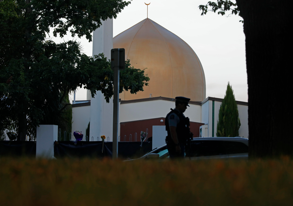 FILE - In this March 17, 2019, file photo, a police officer stands guard in front of the Al Noor mosque in Christchurch, New Zealand. On Friday, the imam, Gamal Fouda, had just finished the Khutbah, the formal sermon that’s delivered in Arabic, and he had started the next part in which he translated it into English. As the gunman approached the mosque, a man in the entrance called out cheerfully, “Hello, brother.” Brenton Tarrant fired several shots, one after another, and walked past the first bodies.(AP Photo/Vincent Yu, File) FILE - In this March 17, 2019, file photo, a police officer stands guard in front of the Al Noor mosque in Christchurch, New Zealand. On Friday, the imam, Gamal Fouda, had just finished the Khutbah, the formal sermon that’s delivered in Arabic, and he had started the next part in which he translated it into English. As the gunman approached the mosque, a man in the entrance called out cheerfully, “Hello, brother.” Brenton Tarrant fired several shots, one after another, and walked past the first bodies.(AP Photo/Vincent Yu, File)