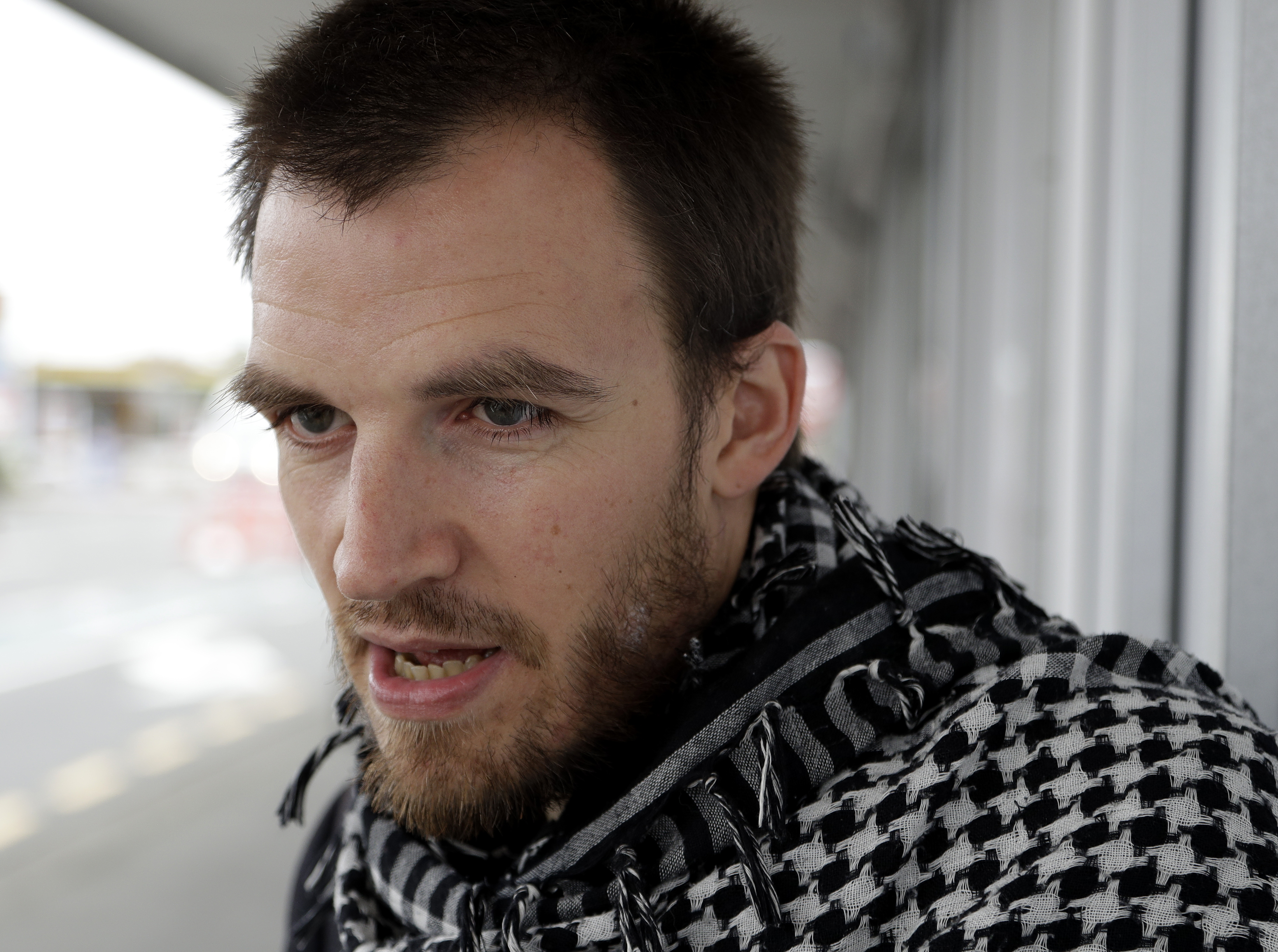 FILE - In this March 17, 2019, file photo, Linwood Mosque shooting survivor Elliot Dawson speaks near the mosque in Christchurch, New Zealand. Dawson was praying with about 80 others when he heard the first shots. No one reacted at first, because they were immersed in prayer. (AP Photo/Mark Baker, File) FILE - In this March 17, 2019, file photo, Linwood Mosque shooting survivor Elliot Dawson speaks near the mosque in Christchurch, New Zealand. Dawson was praying with about 80 others when he heard the first shots. No one reacted at first, because they were immersed in prayer. (AP Photo/Mark Baker, File)