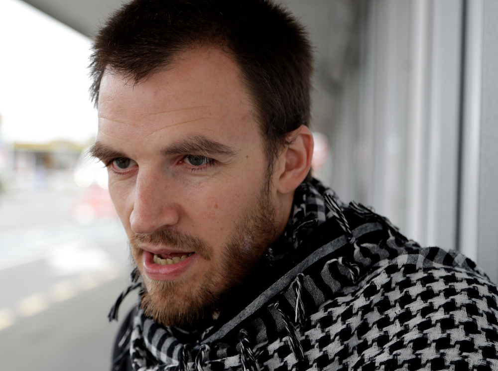 FILE - In this March 17, 2019, file photo, Linwood Mosque shooting survivor Elliot Dawson speaks near the mosque in Christchurch, New Zealand. Dawson was praying with about 80 others when he heard the first shots. No one reacted at first, because they were immersed in prayer. (AP Photo/Mark Baker, File) FILE - In this March 17, 2019, file photo, Linwood Mosque shooting survivor Elliot Dawson speaks near the mosque in Christchurch, New Zealand. Dawson was praying with about 80 others when he heard the first shots. No one reacted at first, because they were immersed in prayer. (AP Photo/Mark Baker, File)