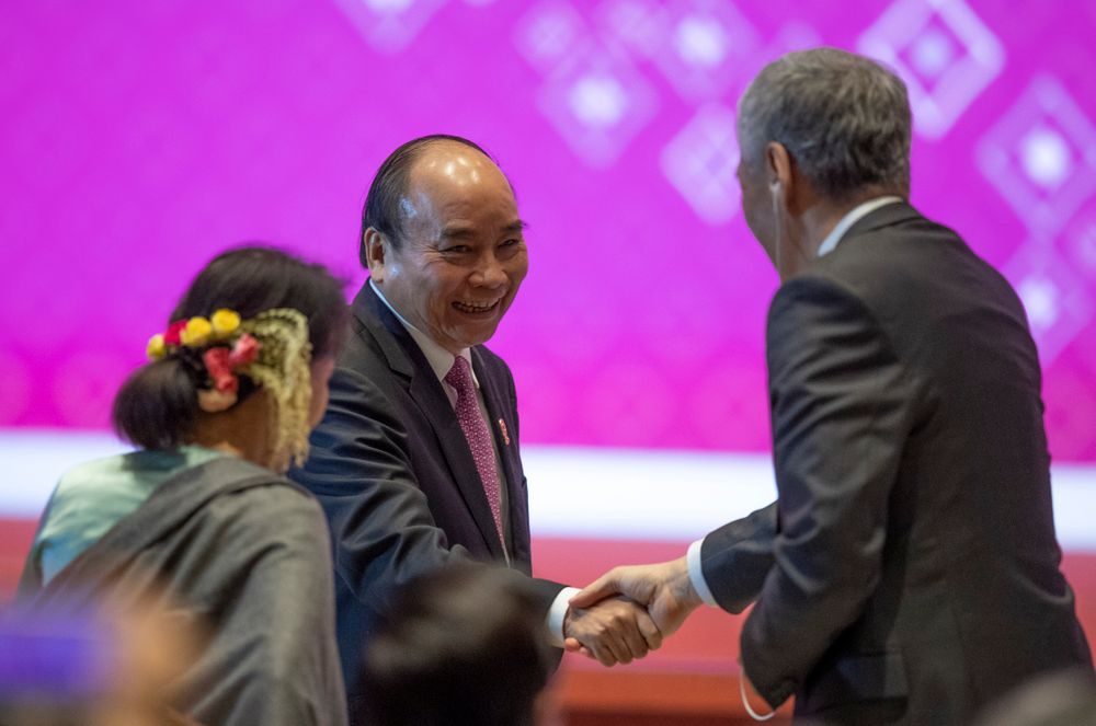 Vietnam Prime Minister Nguyen Xuan Phuc shakes hands during the closing ceremony of ASEAN summit in Nonthaburi, Thailand, Monday, Nov. 4, 2019. (AP Photo/Gemunu Amarasinghe) Vietnam Prime Minister Nguyen Xuan Phuc shakes hands during the closing ceremony of ASEAN summit in Nonthaburi, Thailand, Monday, Nov. 4, 2019. (AP Photo/Gemunu Amarasinghe)
