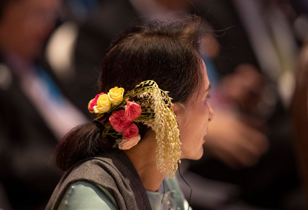 Myanmar leader Aung San Suu Kyi wears a floral arrangement in her hair during the ASEAN-Japan summit in Nonthaburi, Thailand, Monday, Nov. 4, 2019. (AP Photo/Gemunu Amarasinghe) Myanmar leader Aung San Suu Kyi wears a floral arrangement in her hair during the ASEAN-Japan summit in Nonthaburi, Thailand, Monday, Nov. 4, 2019. (AP Photo/Gemunu Amarasinghe)