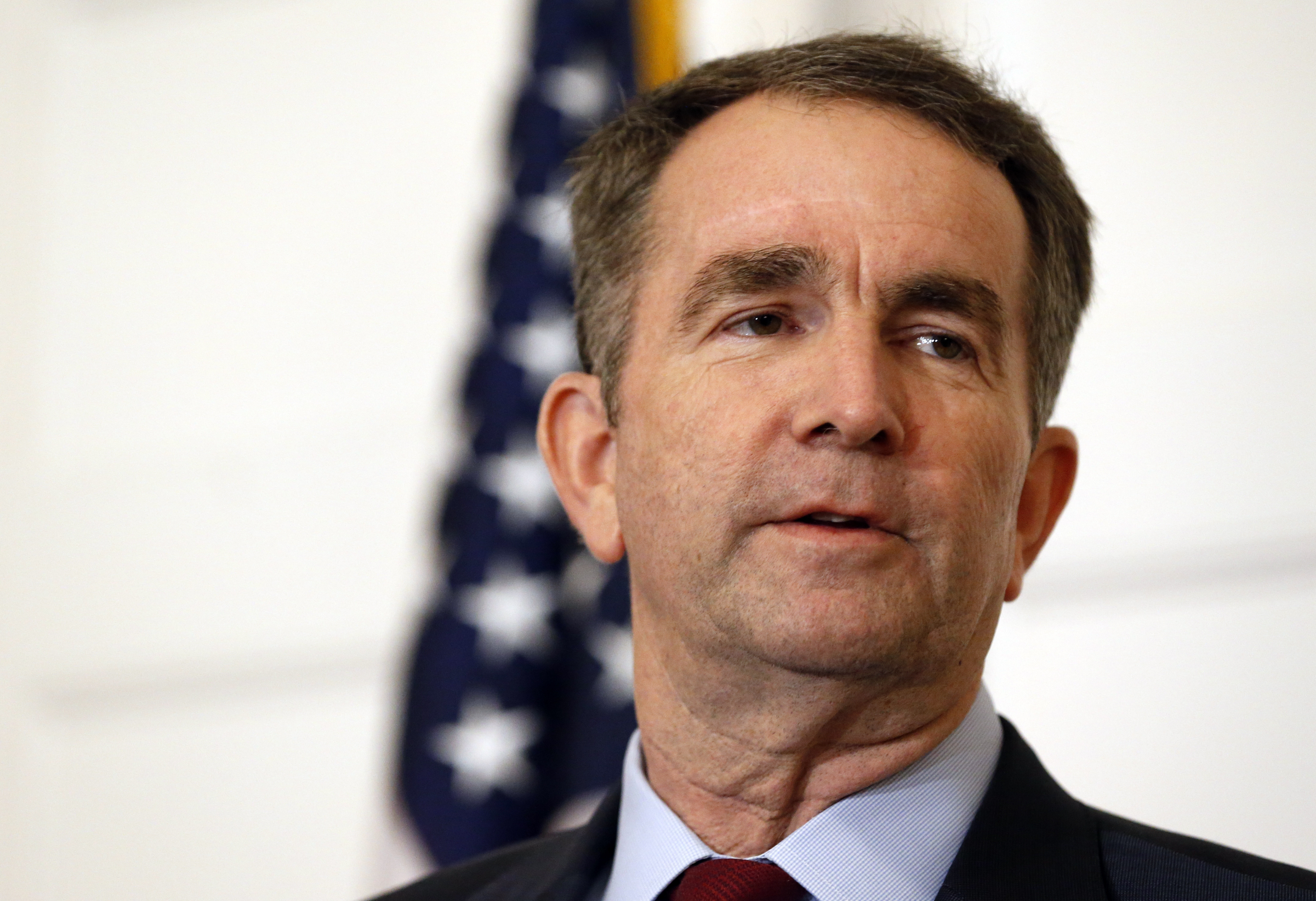FILE - In this Feb. 2, 2019 file photo, Virginia Gov. Ralph Northam speaks during a news conference in the Governor's Mansion in Richmond, Va. Northam clung to his office Tuesday, Feb. 5, amid intense political fallout over a racist photo in his 1984 medical school yearbook and uncertainty about the future of the state's government. (AP Photo/Steve Helber, File) FILE - In this Feb. 2, 2019 file photo, Virginia Gov. Ralph Northam speaks during a news conference in the Governor's Mansion in Richmond, Va. Northam clung to his office Tuesday, Feb. 5, amid intense political fallout over a racist photo in his 1984 medical school yearbook and uncertainty about the future of the state's government. (AP Photo/Steve Helber, File)
