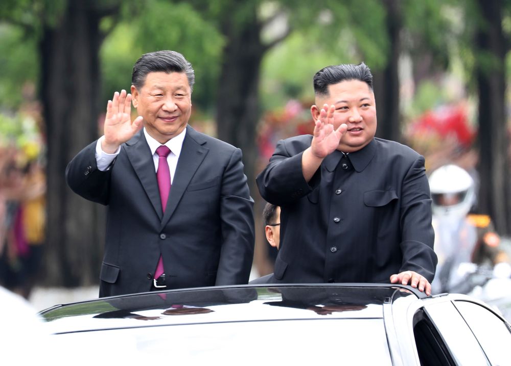 In this Thursday, June 20, 2019, photo released by China's Xinhua News Agency, visiting Chinese President Xi Jinping, left, and North Korean leader Kim Jong Un wave from an open top limousine as they travel along a street in Pyongyang, North Korea. North Korean leader Kim Jong Un, meeting in Pyongyang with Chinese President Xi Jinping, said Thursday that his country is waiting for a desired response in stalled nuclear talks with the United States. (Ju Peng/Xinhua via AP) In this Thursday, June 20, 2019, photo released by China's Xinhua News Agency, visiting Chinese President Xi Jinping, left, and North Korean leader Kim Jong Un wave from an open top limousine as they travel along a street in Pyongyang, North Korea. North Korean leader Kim Jong Un, meeting in Pyongyang with Chinese President Xi Jinping, said Thursday that his country is waiting for a desired response in stalled nuclear talks with the United States. (Ju Peng/Xinhua via AP)