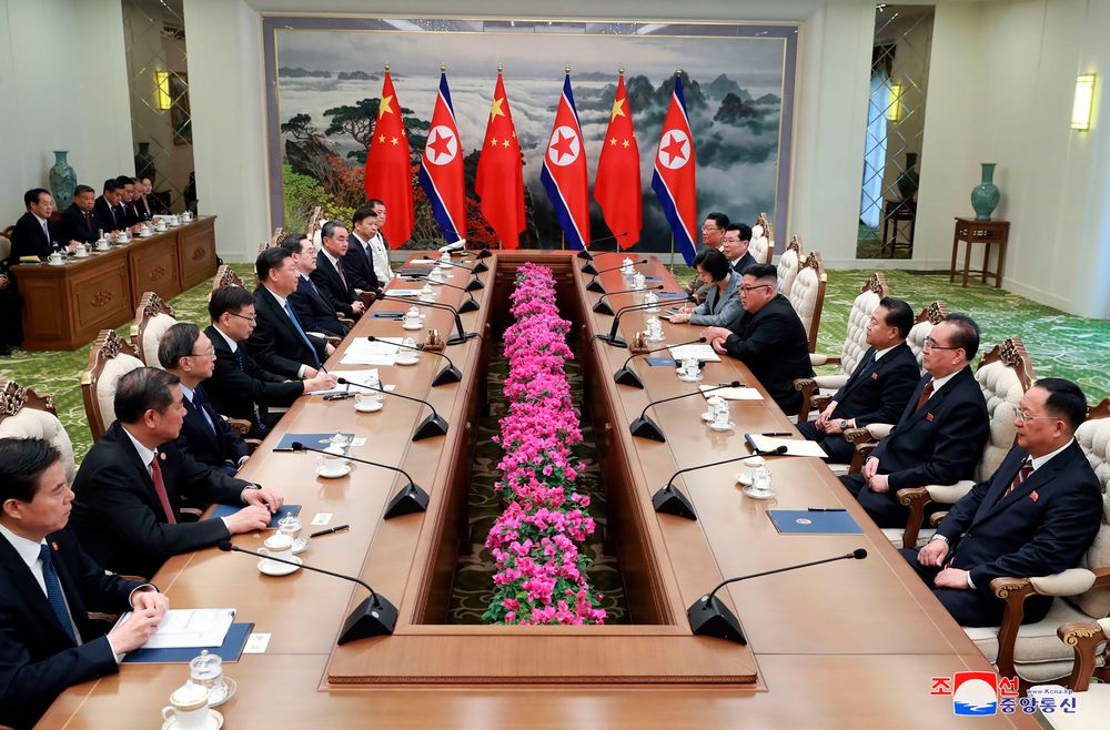 In this Thursday, June 20, 2019, photo provided by the North Korean government, North Korean leader Kim Jong Un, fourth right, and Chinese President Xi Jinping, fifth left, meet at Kumsusan guest house in Pyongyang, North Korea. The content of this image is as provided and cannot be independently verified. Korean language watermark on image as provided by source reads: In this Thursday, June 20, 2019, photo provided by the North Korean government, North Korean leader Kim Jong Un, fourth right, and Chinese President Xi Jinping, fifth left, meet at Kumsusan guest house in Pyongyang, North Korea. The content of this image is as provided and cannot be independently verified. Korean language watermark on image as provided by source reads: