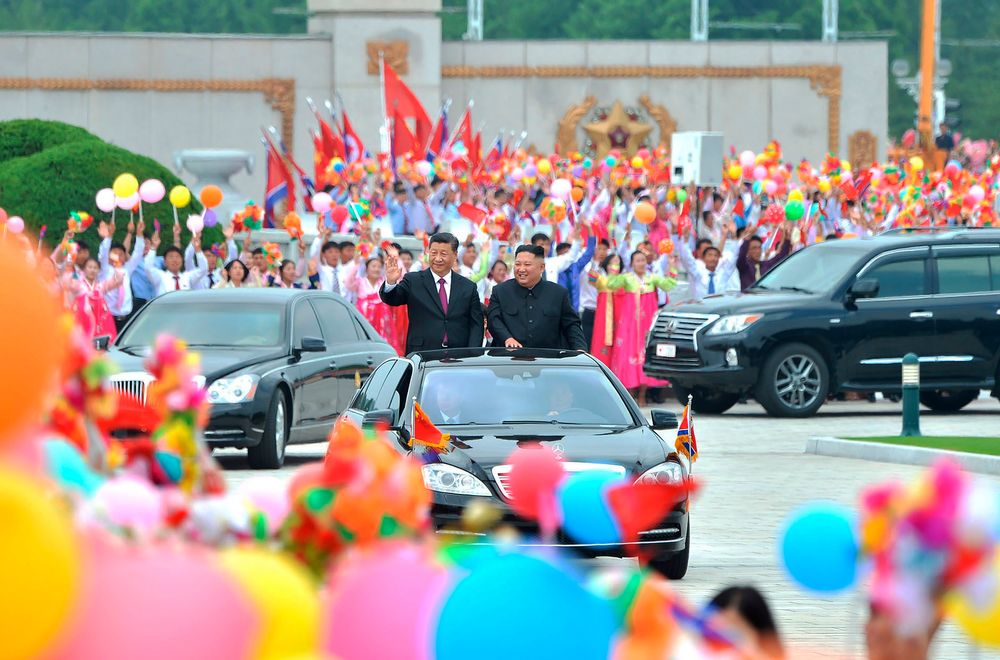 In this Thursday, June 20, 2019, photo provided by the North Korean government, North Korean leader Kim Jong Un, right, and Chinese President Xi Jinping acknowledge welcoming people on a street in Pyongyang, North Korea. The content of this image is as provided and cannot be independently verified. (Korean Central News Agency/Korea News Service via AP) In this Thursday, June 20, 2019, photo provided by the North Korean government, North Korean leader Kim Jong Un, right, and Chinese President Xi Jinping acknowledge welcoming people on a street in Pyongyang, North Korea. The content of this image is as provided and cannot be independently verified. (Korean Central News Agency/Korea News Service via AP)