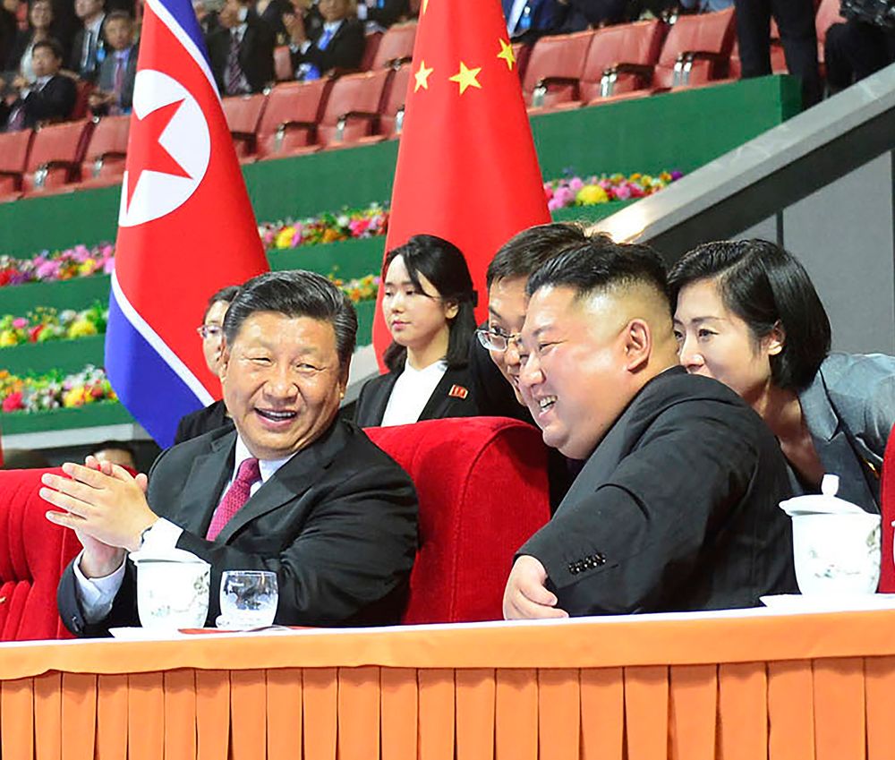 In this Thursday, June 20, 2019, photo provided by the North Korean government, North Korean leader Kim Jong Un, right, and Chinese President Xi Jinping, left, watch a mass gymnastic performance at the May Day Stadium in Pyongyang, North Korea. The content of this image is as provided and cannot be independently verified. (Korean Central News Agency/Korea News Service via AP) In this Thursday, June 20, 2019, photo provided by the North Korean government, North Korean leader Kim Jong Un, right, and Chinese President Xi Jinping, left, watch a mass gymnastic performance at the May Day Stadium in Pyongyang, North Korea. The content of this image is as provided and cannot be independently verified. (Korean Central News Agency/Korea News Service via AP)