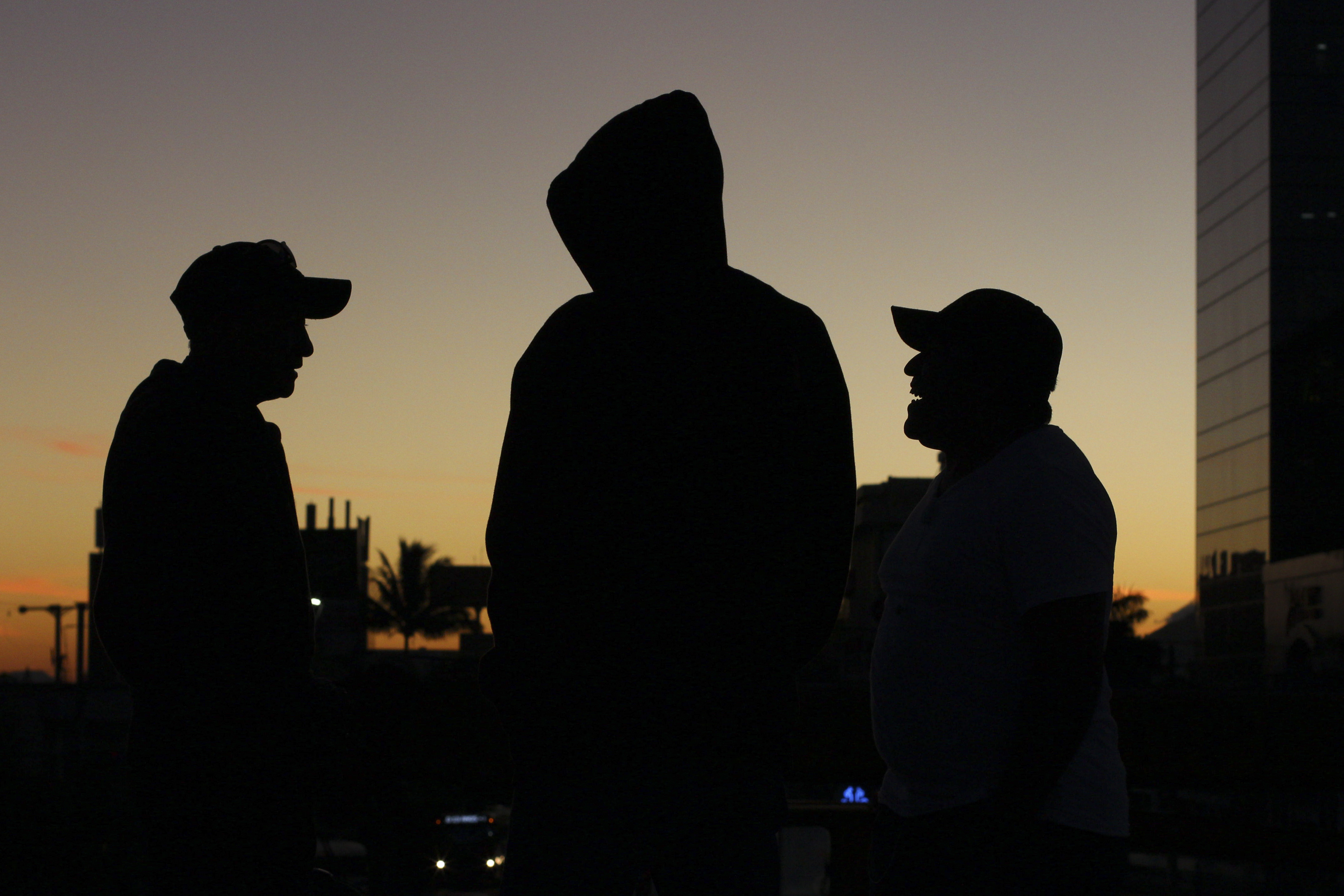 Salvadoran migrants talk as they prepare to set off for the U.S. border with others in a caravan, in San Salvador, El Salvador, at dawn Wednesday, Jan. 16, 2019. Migrants fleeing Central America's Northern Triangle region comprising Honduras, El Salvador and Guatemala routinely cite poverty and rampant gang violence as their motivation for leaving. (AP Photo/Salvador Melendez) Salvadoran migrants talk as they prepare to set off for the U.S. border with others in a caravan, in San Salvador, El Salvador, at dawn Wednesday, Jan. 16, 2019. Migrants fleeing Central America's Northern Triangle region comprising Honduras, El Salvador and Guatemala routinely cite poverty and rampant gang violence as their motivation for leaving. (AP Photo/Salvador Melendez)