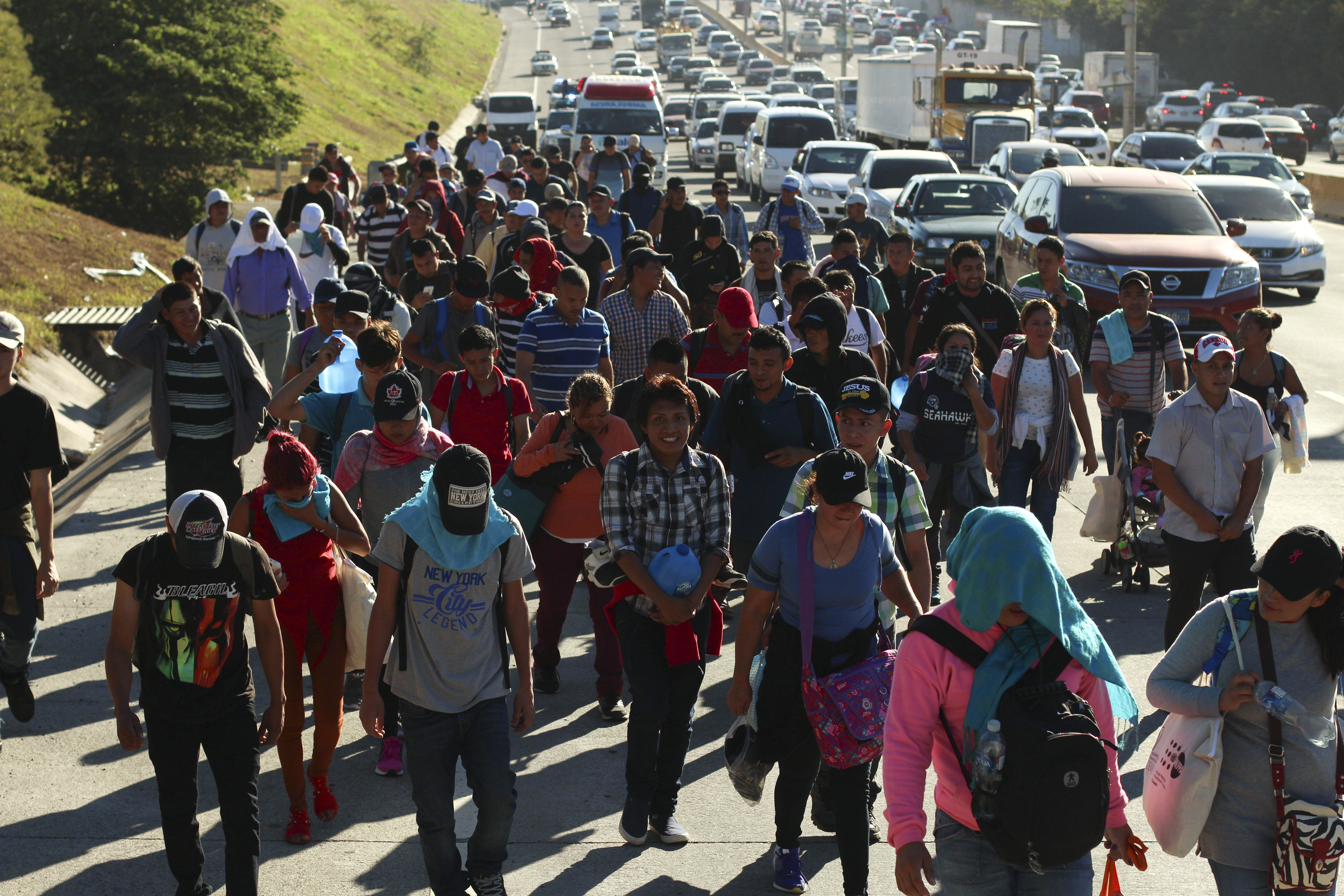 Migrants traveling in a group begin their journey toward the U.S. border as they walk along a highway in San Salvador, El Salvador, early Wednesday, Jan. 16, 2019. Migrants fleeing Central America's Northern Triangle region comprising Honduras, El Salvador and Guatemala routinely cite poverty and rampant gang violence as their motivation for leaving. (AP Photo/Salvador Melendez) Migrants traveling in a group begin their journey toward the U.S. border as they walk along a highway in San Salvador, El Salvador, early Wednesday, Jan. 16, 2019. Migrants fleeing Central America's Northern Triangle region comprising Honduras, El Salvador and Guatemala routinely cite poverty and rampant gang violence as their motivation for leaving. (AP Photo/Salvador Melendez)