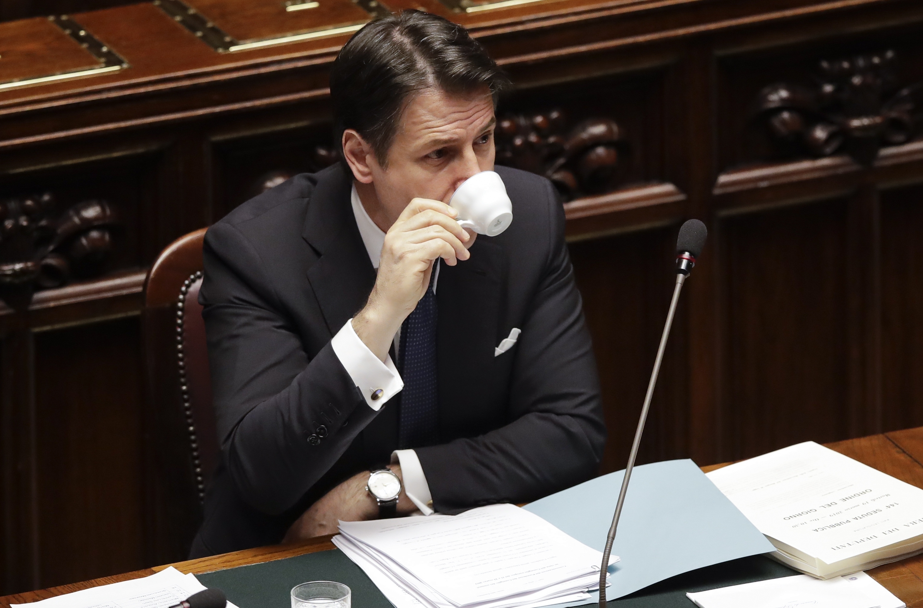 Italian Premier Giuseppe Conte drinks a coffee before addressing the Lower Chamber of the Italian parliament in Rome, Tuesday, March 19, 2019. (AP Photo/Alessandra Tarantino) Italian Premier Giuseppe Conte drinks a coffee before addressing the Lower Chamber of the Italian parliament in Rome, Tuesday, March 19, 2019. (AP Photo/Alessandra Tarantino)