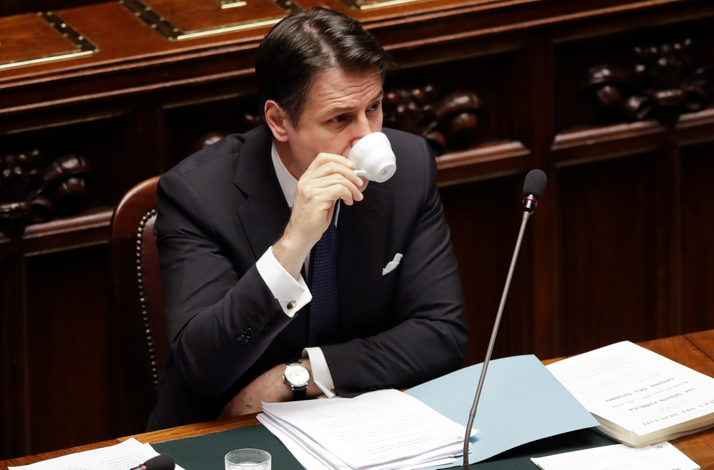 Italian Premier Giuseppe Conte drinks a coffee before addressing the Lower Chamber of the Italian parliament in Rome, Tuesday, March 19, 2019. (AP Photo/Alessandra Tarantino) Italian Premier Giuseppe Conte drinks a coffee before addressing the Lower Chamber of the Italian parliament in Rome, Tuesday, March 19, 2019. (AP Photo/Alessandra Tarantino)