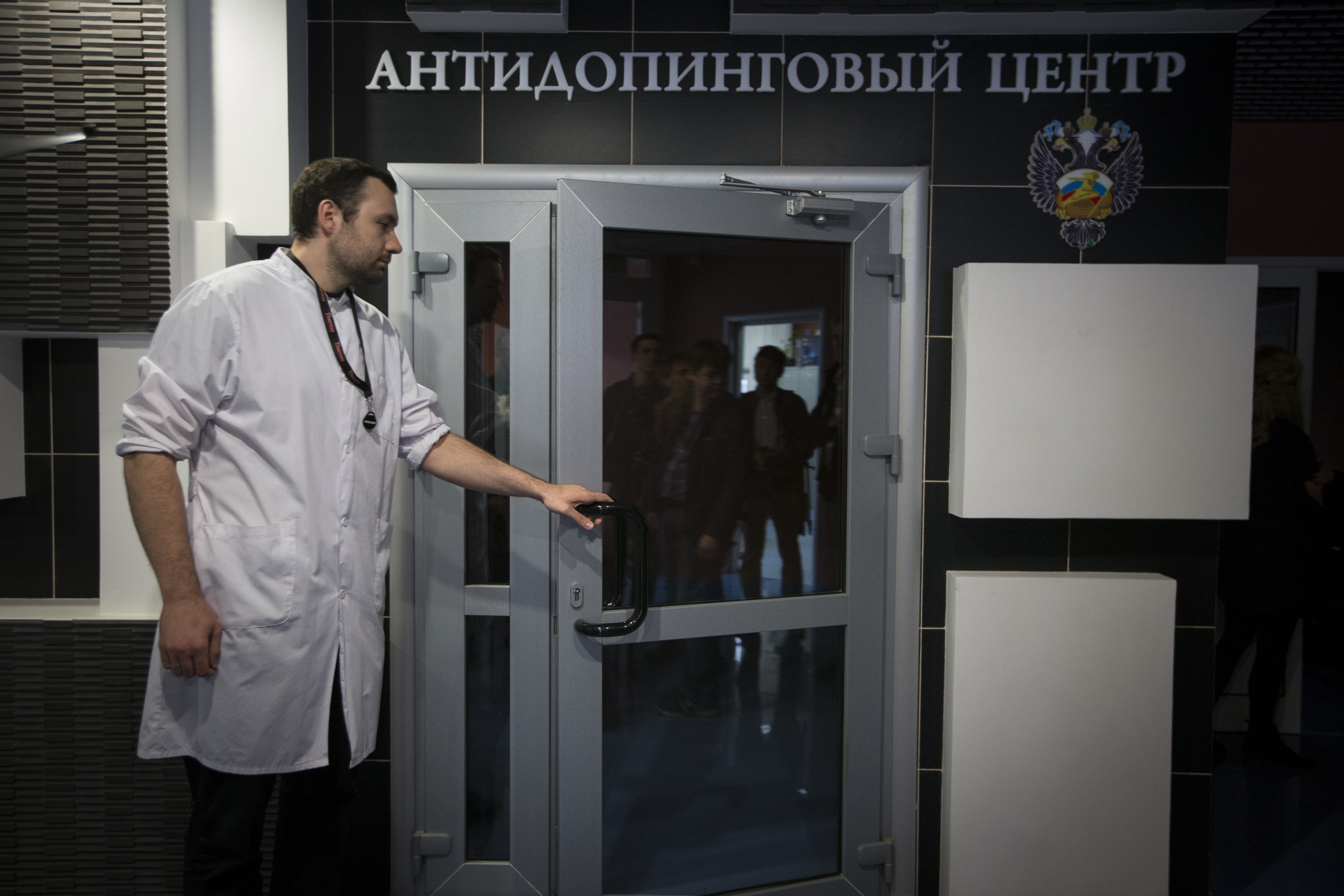 FILE - In this Tuesday, May 24, 2016 file photo, Grigory Dudko opens a door for journalists during a visit to Russia's national drug-testing laboratory in Moscow, Russia. Vladimir Putin's spokesman says Russia is FILE - In this Tuesday, May 24, 2016 file photo, Grigory Dudko opens a door for journalists during a visit to Russia's national drug-testing laboratory in Moscow, Russia. Vladimir Putin's spokesman says Russia is