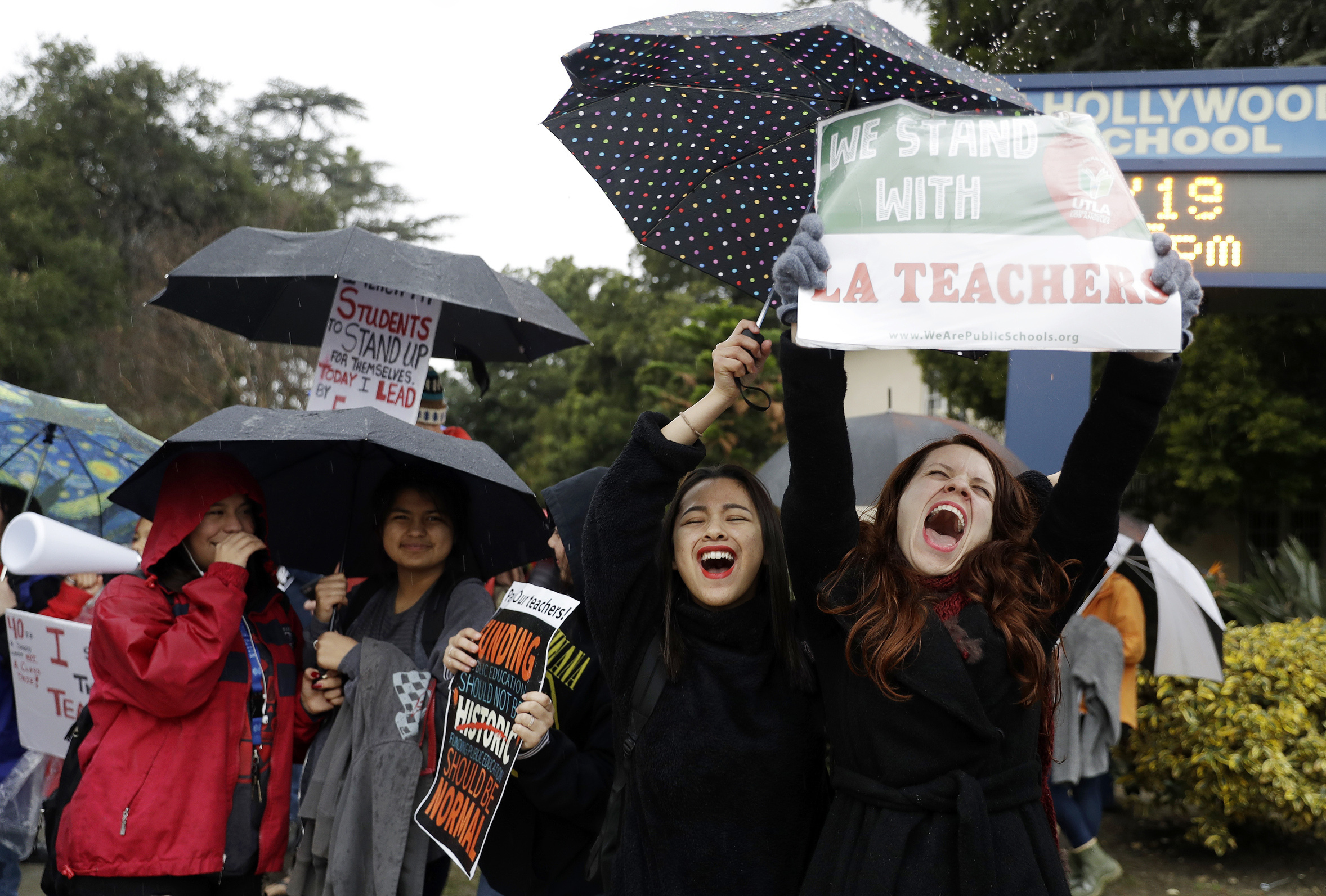 Maria Arienza, right, an English and Spanish teacher, shouts slogans alongside her student Stephanie Medrano, second from right, outside of North Hollywood High School Tuesday, Jan. 15, 2019, in Los Angeles. Teachers in the huge Los Angeles Unified School District walked picket lines again Tuesday as administrators urged them to return to classrooms and for their union to return to the bargaining table. (AP Photo/Marcio Jose Sanchez) Maria Arienza, right, an English and Spanish teacher, shouts slogans alongside her student Stephanie Medrano, second from right, outside of North Hollywood High School Tuesday, Jan. 15, 2019, in Los Angeles. Teachers in the huge Los Angeles Unified School District walked picket lines again Tuesday as administrators urged them to return to classrooms and for their union to return to the bargaining table. (AP Photo/Marcio Jose Sanchez)