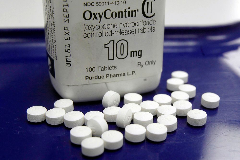 FILE - This Feb. 19, 2013 file photo shows OxyContin pills arranged for a photo at a pharmacy in Montpelier, Vt. State attorneys general and lawyers representing local governments said Tuesday, Aug. 27, 2019, they are in active negotiations with Purdue Pharma, maker of the prescription painkiller OxyContin, as they attempt to reach a landmark settlement over the nation's opioid crisis. (AP Photo/Toby Talbot, File) FILE - This Feb. 19, 2013 file photo shows OxyContin pills arranged for a photo at a pharmacy in Montpelier, Vt. State attorneys general and lawyers representing local governments said Tuesday, Aug. 27, 2019, they are in active negotiations with Purdue Pharma, maker of the prescription painkiller OxyContin, as they attempt to reach a landmark settlement over the nation's opioid crisis. (AP Photo/Toby Talbot, File)