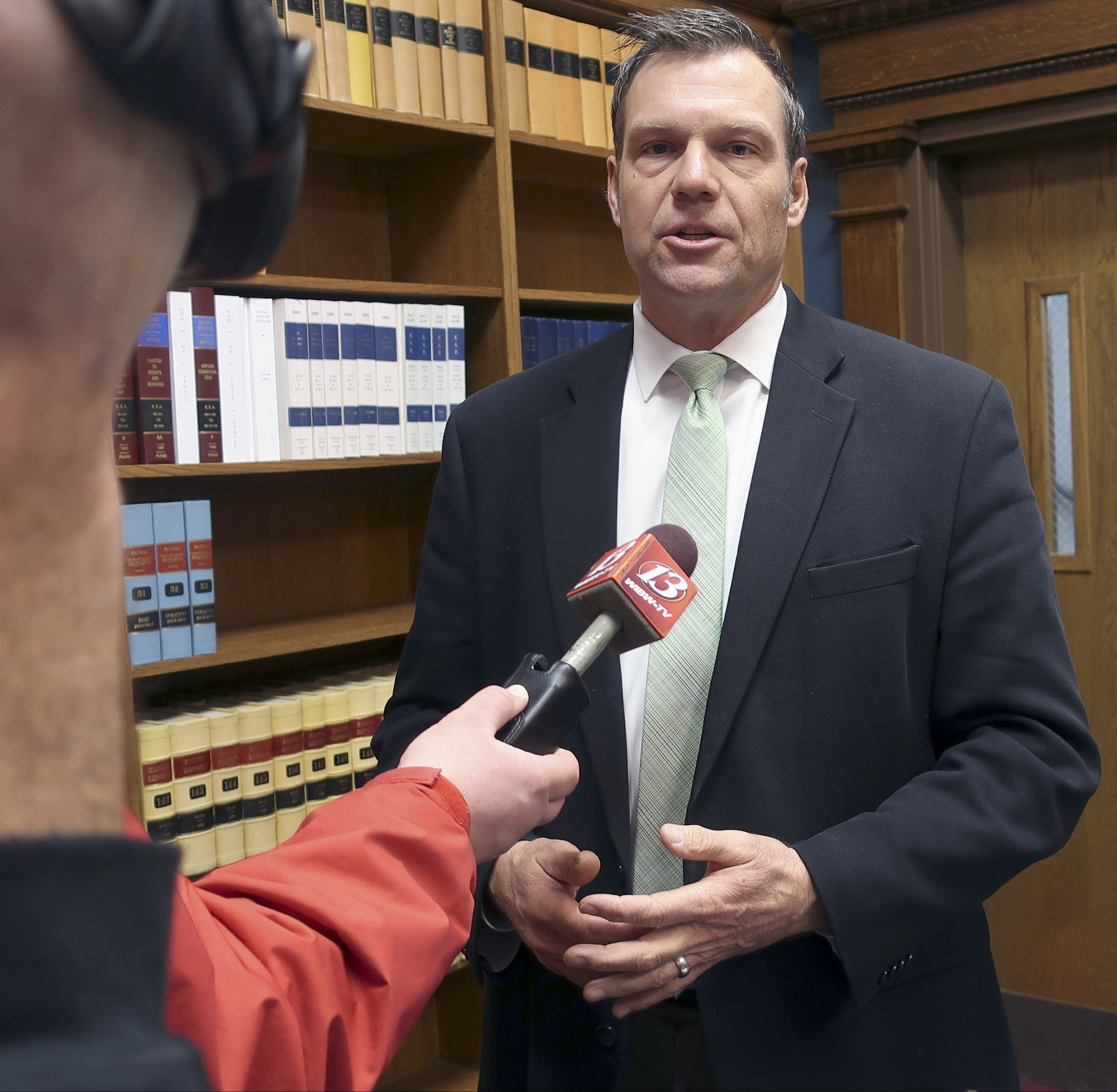 FILE - In this Nov. 30, 2018 file photo, then Kansas Secretary of State Kris Kobach responds to questions from reporters in Topeka, Kan. An appeals court in Salt Lake City, will consider Monday, March 18, 2019, the constitutionality of a struck down Kansas statute that had required people to provide documents proving U.S. citizenship before they could register to vote. (AP Photo/John Hanna, File) FILE - In this Nov. 30, 2018 file photo, then Kansas Secretary of State Kris Kobach responds to questions from reporters in Topeka, Kan. An appeals court in Salt Lake City, will consider Monday, March 18, 2019, the constitutionality of a struck down Kansas statute that had required people to provide documents proving U.S. citizenship before they could register to vote. (AP Photo/John Hanna, File)